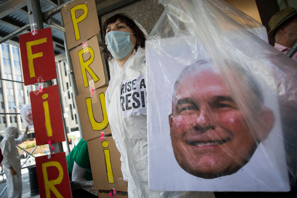 Protesters rally against former EPA administrator Scott Pruitt. New analysis shows prosecution of environmental crimes is declining. (CREDIT: Drew Angerer/Getty Images)