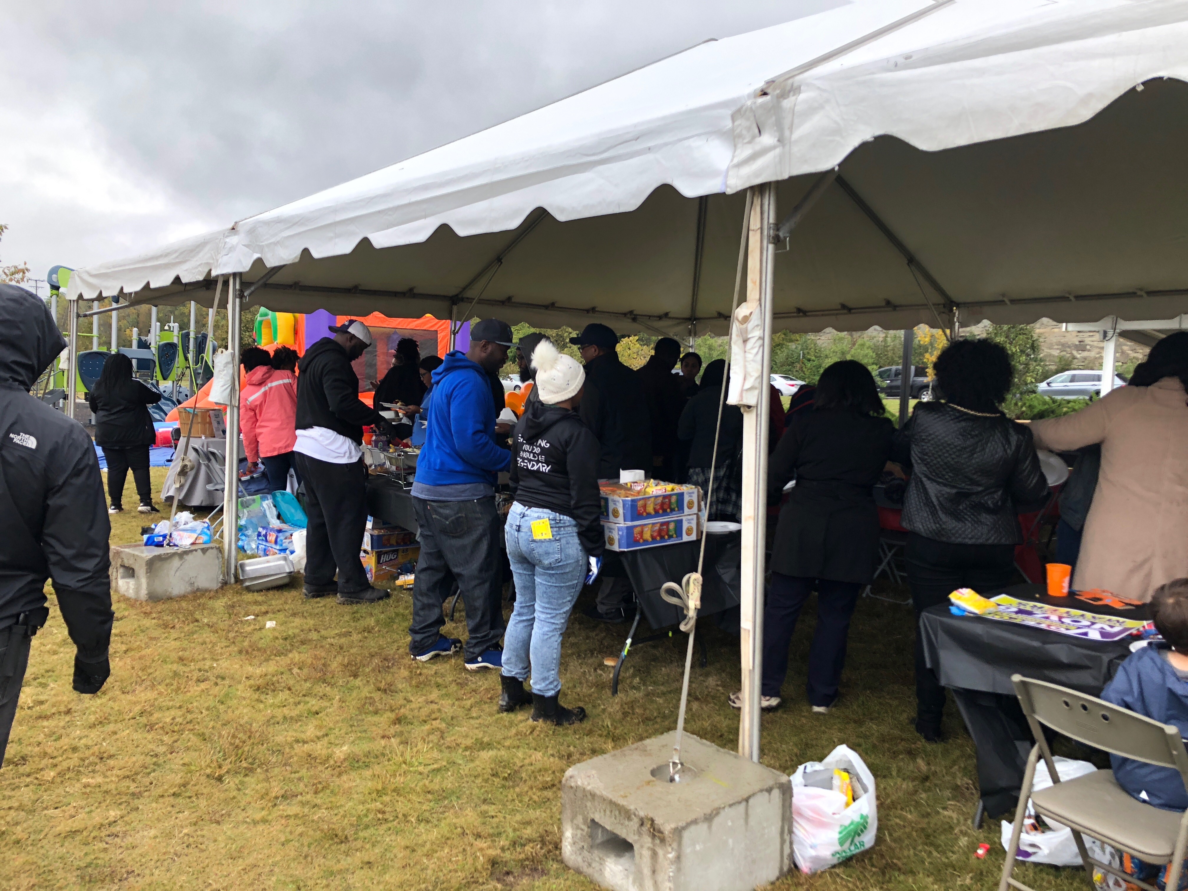 Community members gathered outside the library Saturday. CREDIT: Addy Baird