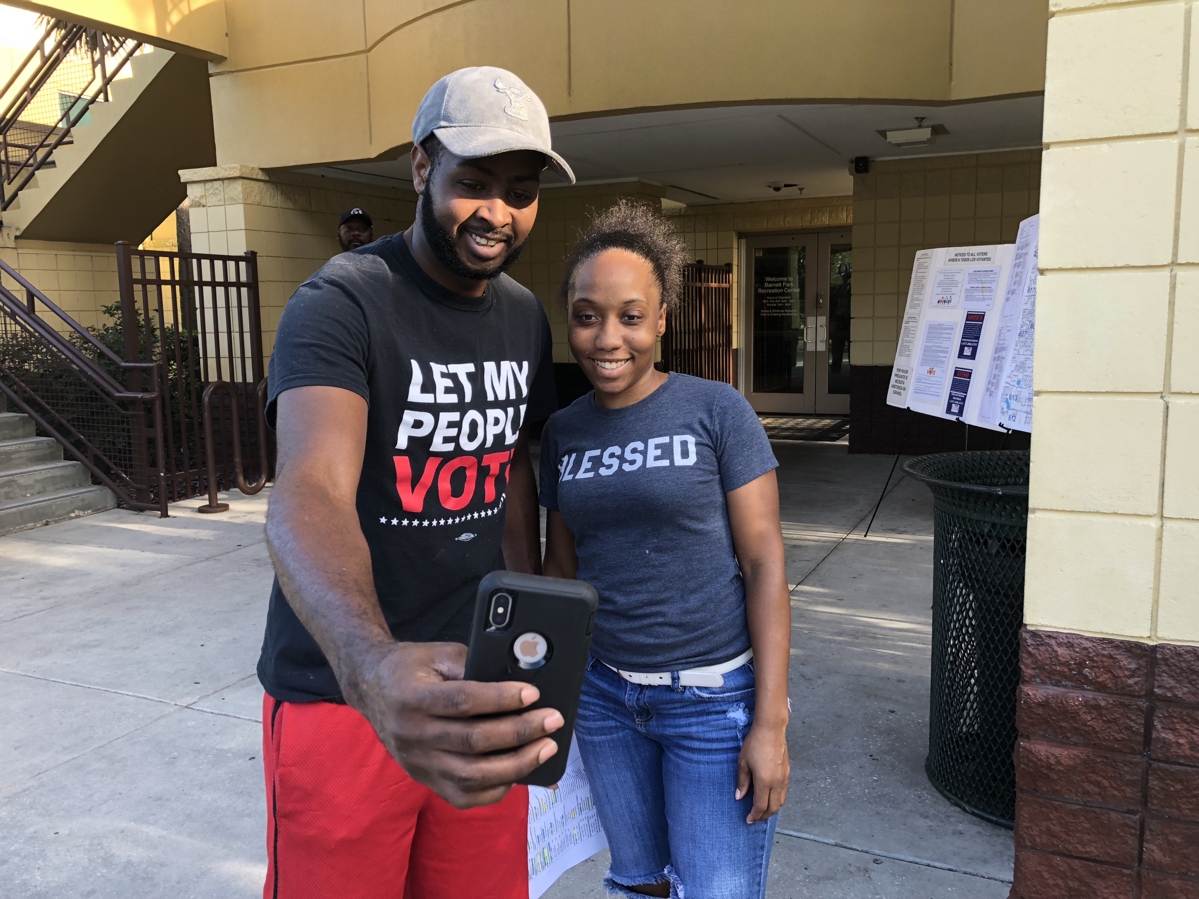 McKenzie takes a selfie with his wife after she cast a ballot in the Florida primary in August. CREDIT: Kira Lerner
