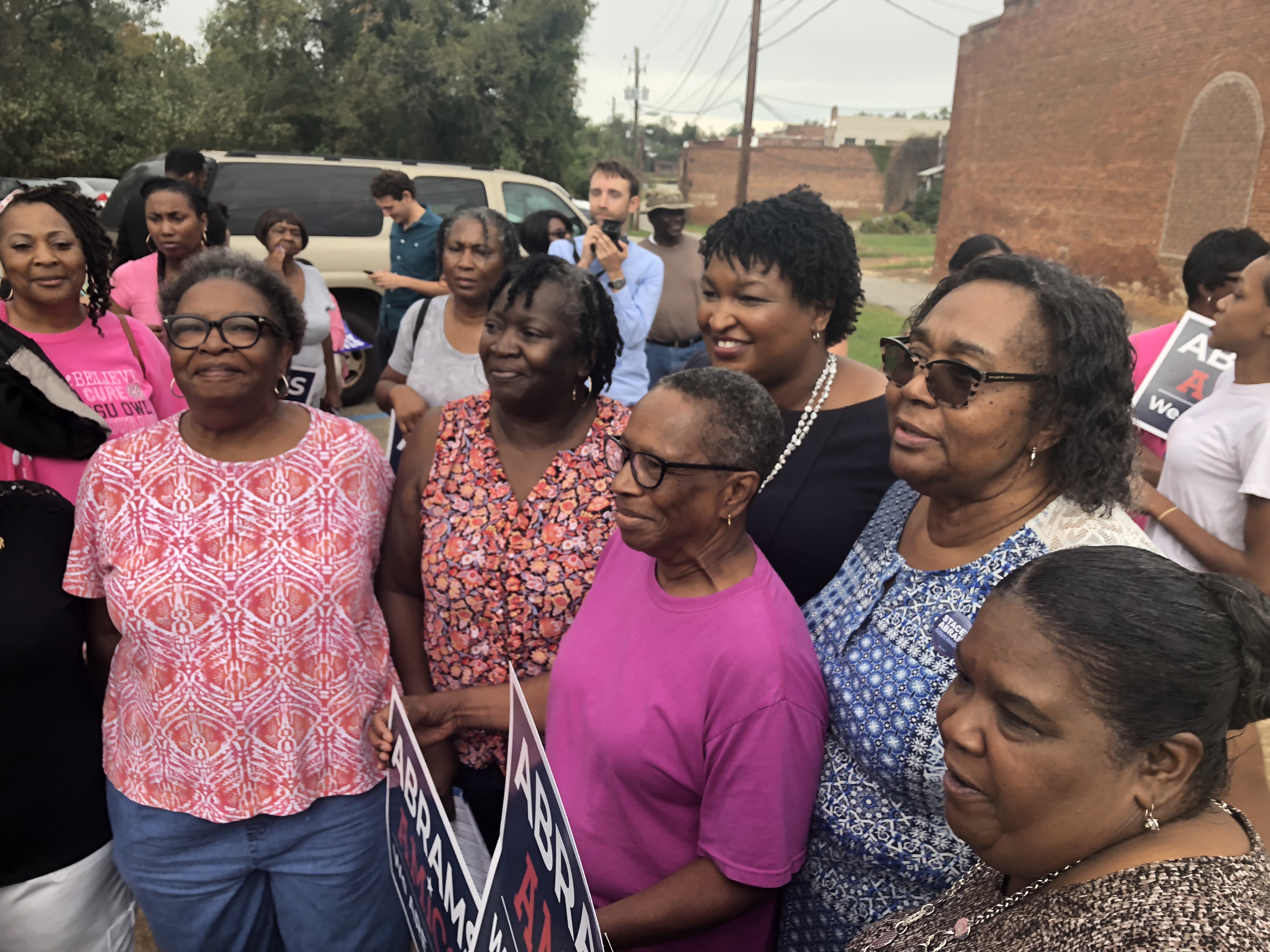 Stacey Abrams takes photos with supporters in Louisville, Georgia Wednesday. CREDIT: Kira Lerner