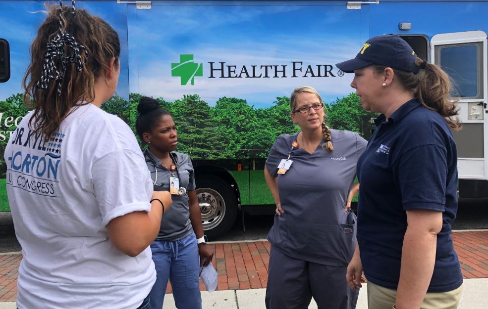 Dr. Kyle Horton (right) speaks with other health care providers in North Carolina in wake of Hurricane Florence. CREDIT: Campaign of Kyle Horton