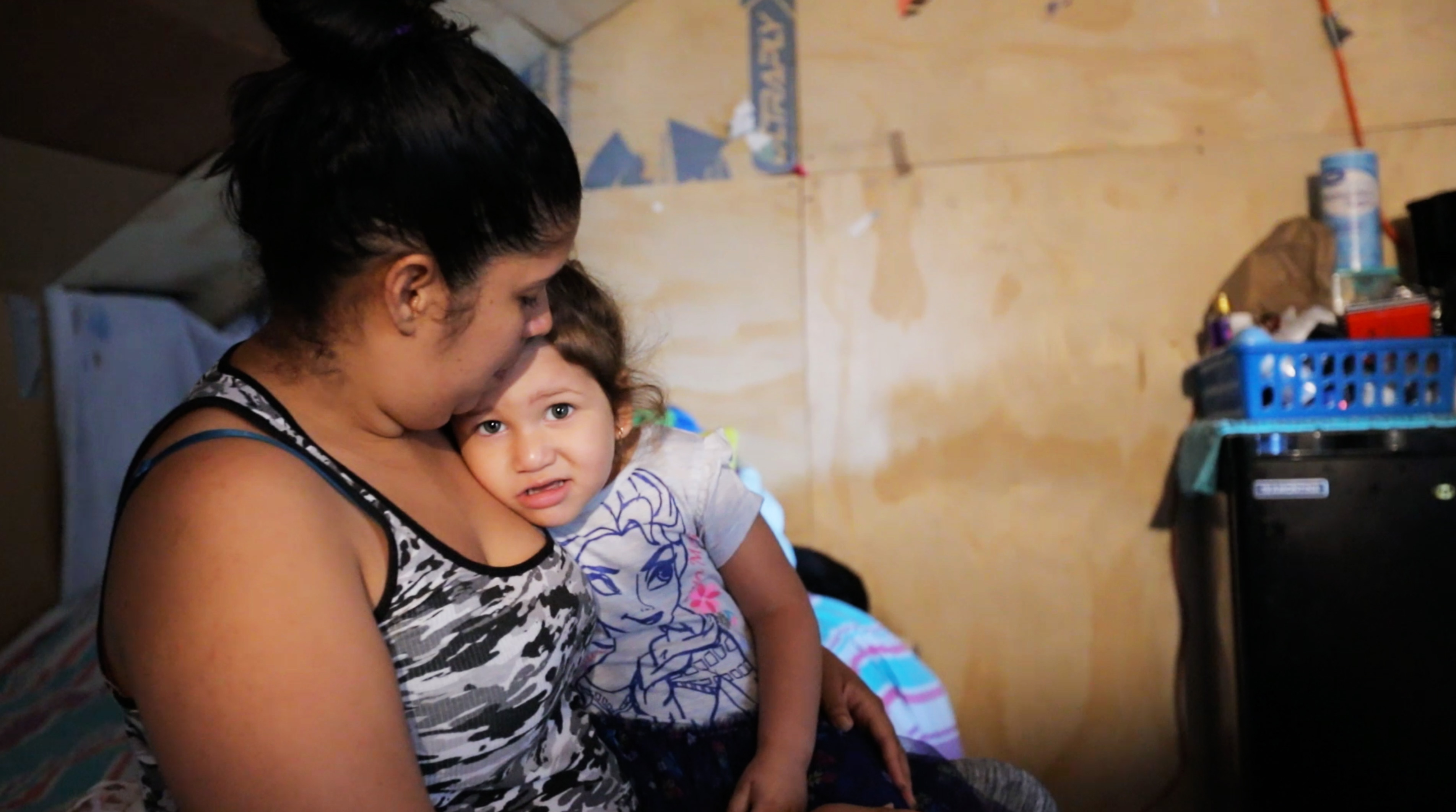 Génesis Ayala Torres holds her two-year-old daughter, Evangeline, at their attic apartment in York, PA, Sept. 20, 2018. Photo by Hai-Lam Phan.