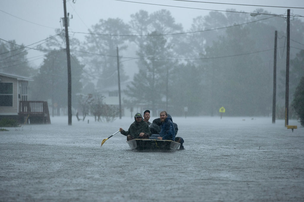 Volunteers from all over North Carolina help rescue residents from their flooded homes during Hurricane Florence September 14, 2018 in New Bern, North Carolina. (Credit: Chip Somodevilla/Getty Images)