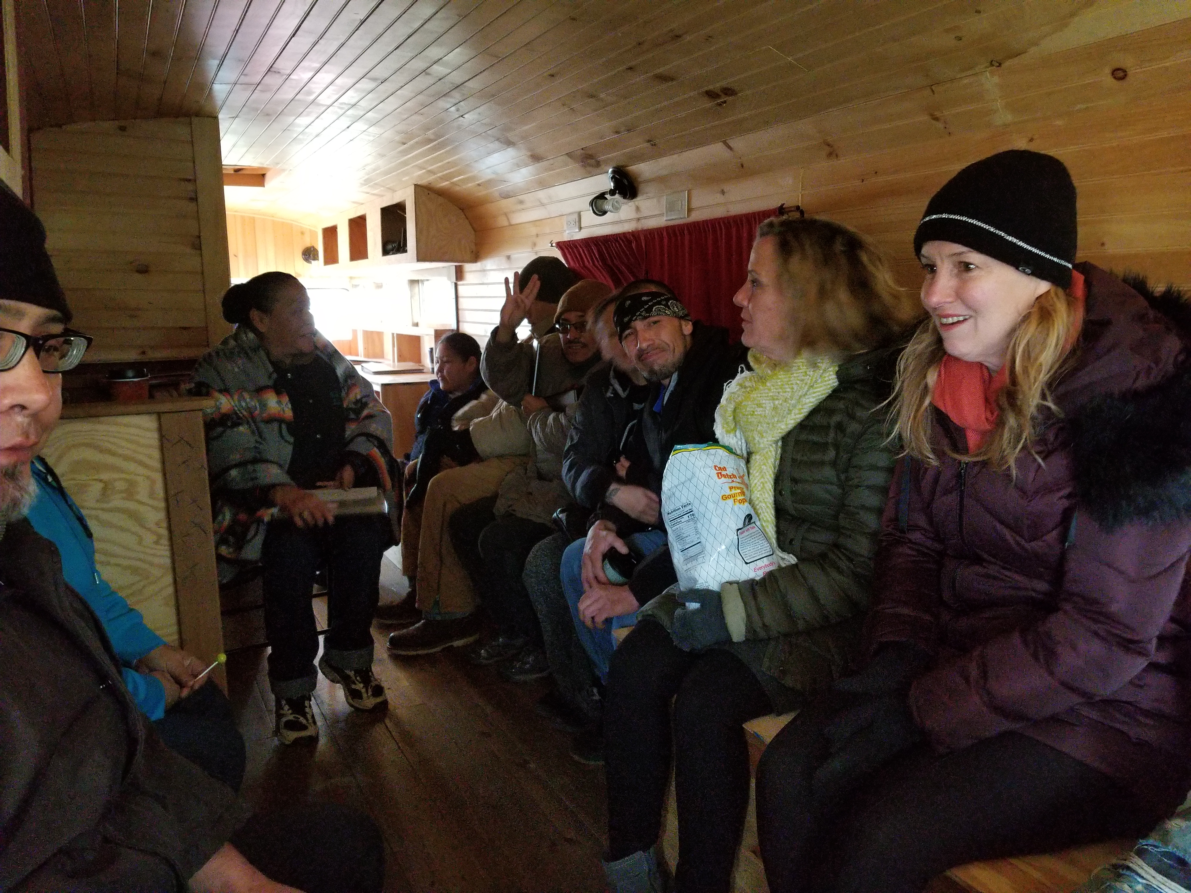 Standing Rock tribal members and workers from the voting rights group Four Directions riding in a bus that drove tribal members to the polls on Election Day, Nov. 6, 2018. (CREDIT: DANIELLE MCLEAN FOR THINKPROGRESS)