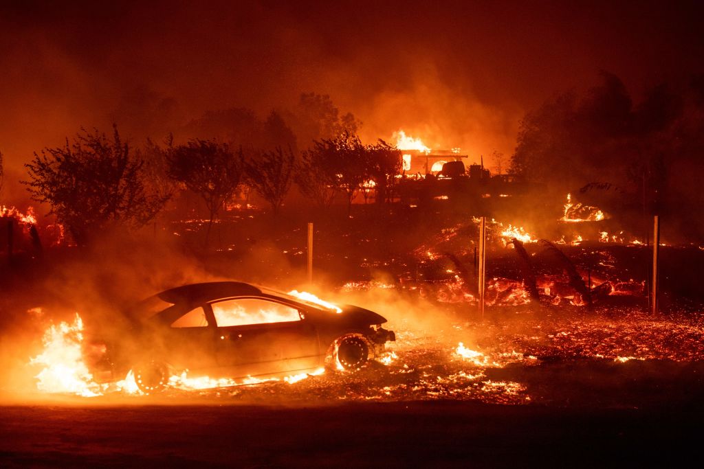 Homes and vehicles burn as the Camp Fire tears through Paradise, California on November 8, 2018. (JOSH EDELSON/AFP/Getty Images)