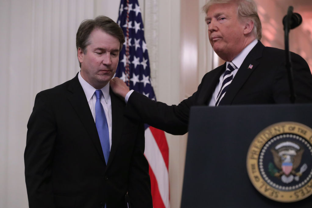 Donald Trump consoles Brett Kavanaugh during his swearing-in ceremony at the White House on October 8, 2018. (Chip Somodevilla/Getty Images)