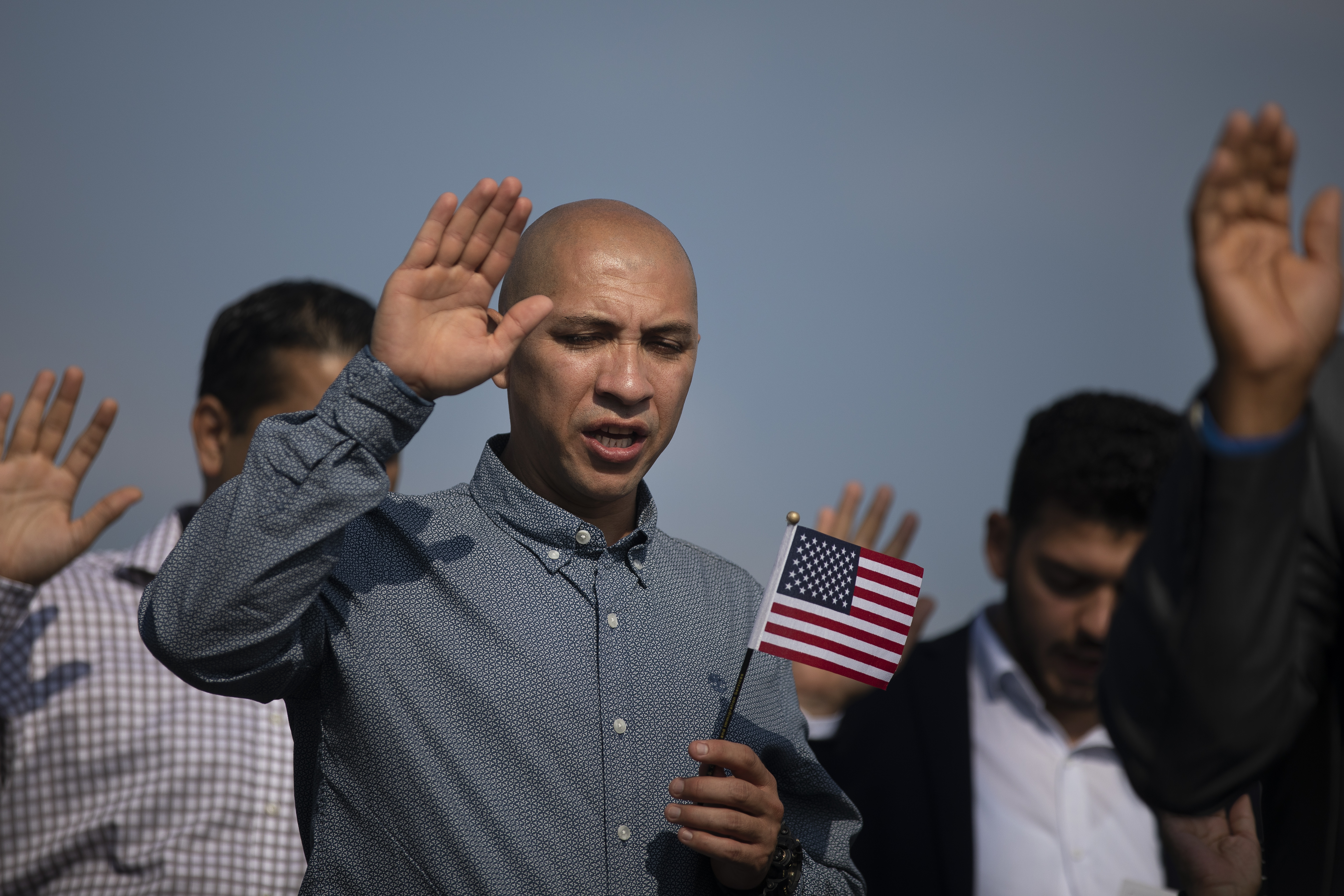 JERSEY CITY, NJ - OCTOBER 2: New American citizens take the Oath of Citizenship during a naturalization ceremony at Liberty State Park, October 2, 2018 in Jersey City, New Jersey. 35 new citizens were naturalized at the ceremony hosted by U.S. Citizenship and Immigration Services (USCIS). (Photo by Drew Angerer/Getty Images)