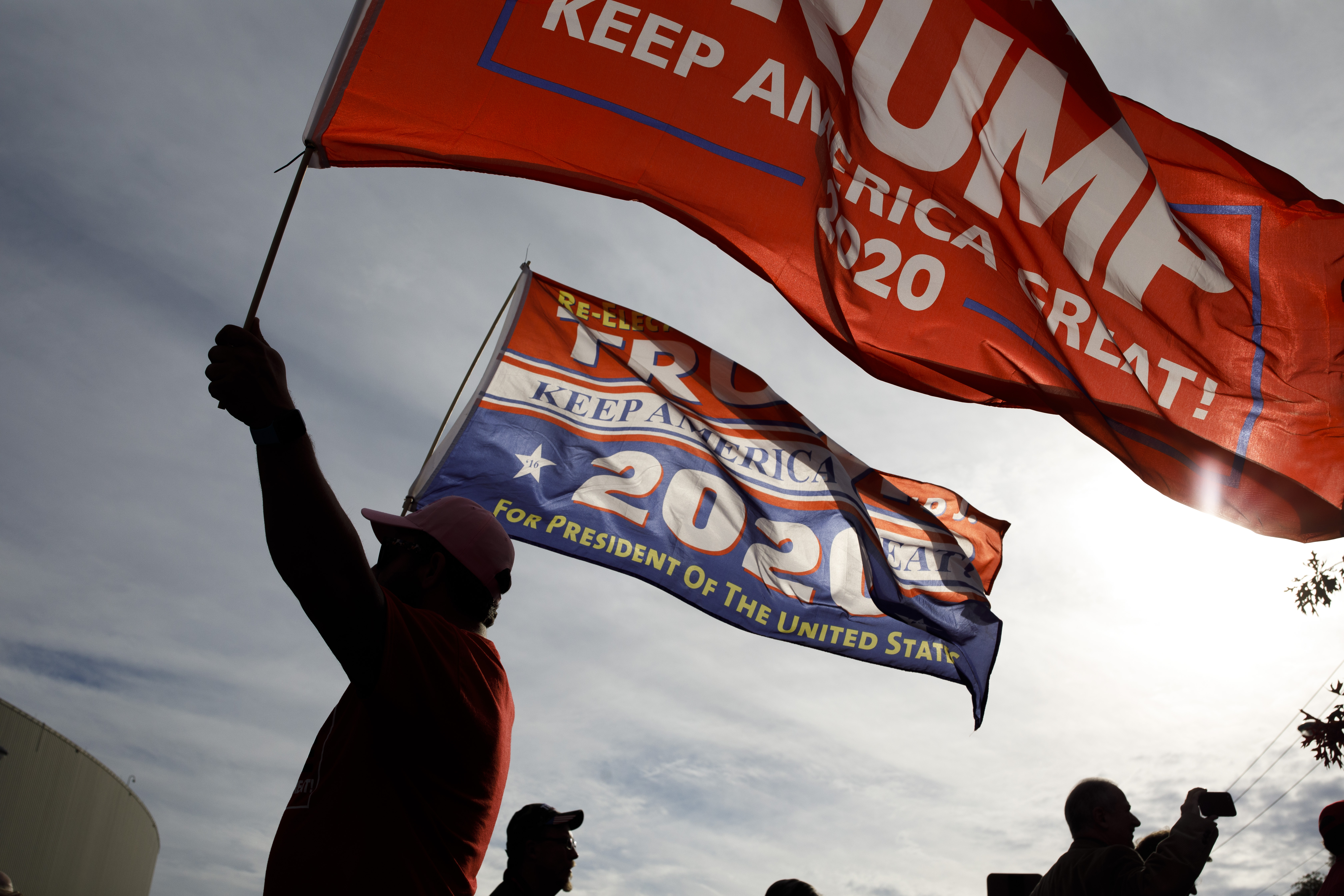 A supporter of President Trump waves flags in Chattanooga, Tennessee. (CREDIT: Drew Angerer/Getty Images)