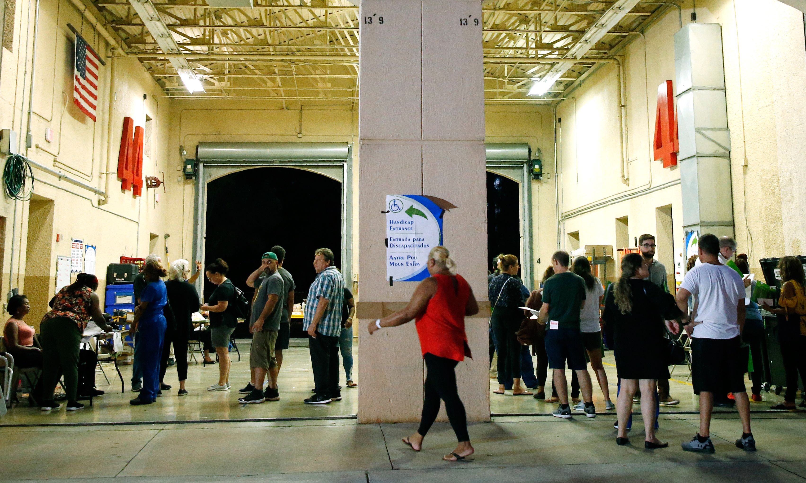 South Florida voters wait in line to cast their ballots late in the day at a busy polling center in Miami, Florida on November 6, 2018. Photo by RHONA WISE / AFP/ GETTY IMAGES