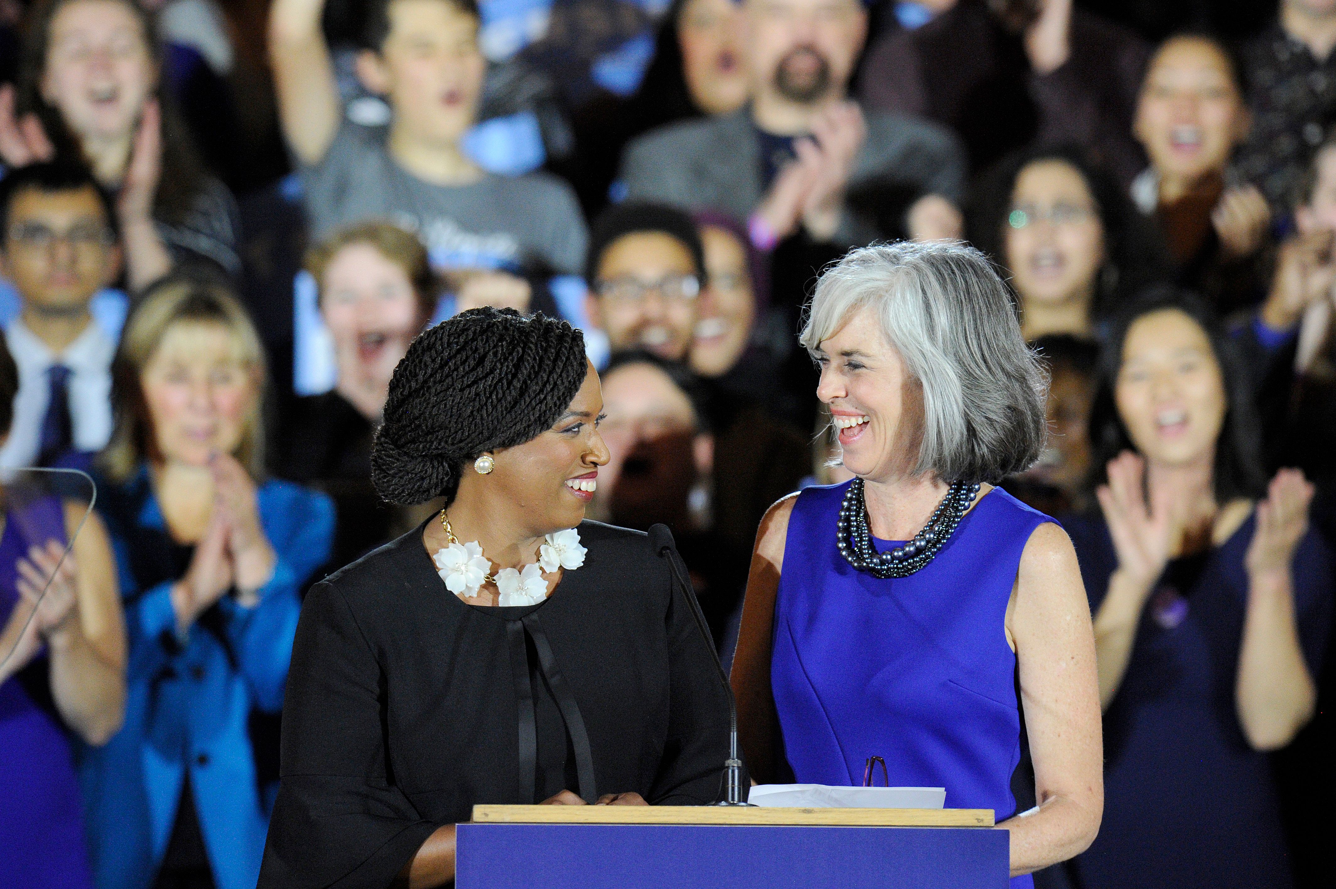 Congresswomen Ayanna Pressley (L) and Katherine Clark introduce Senator Elizabeth Warren (out of frame) at the audience during the Election Day Massachusetts Democratic Coordinated Campaign Election Night Celebration at the Fairmont Copley Hotel in Boston, Massachusetts on November 6, 2018. - Democrats seized control of the lower house of Congress in midterm elections on November 6, 2018, dealing a stern rebuke to Donald Trump almost two years into his polarizing, rollercoaster presidency. Fox and NBC television networks called the result in the US House of Representatives, while confirming expectations that Trump's Republicans will retain control of the Senate. (Photo by Joseph PREZIOSO / AFP) (Photo credit should read JOSEPH PREZIOSO/AFP/Getty Images)