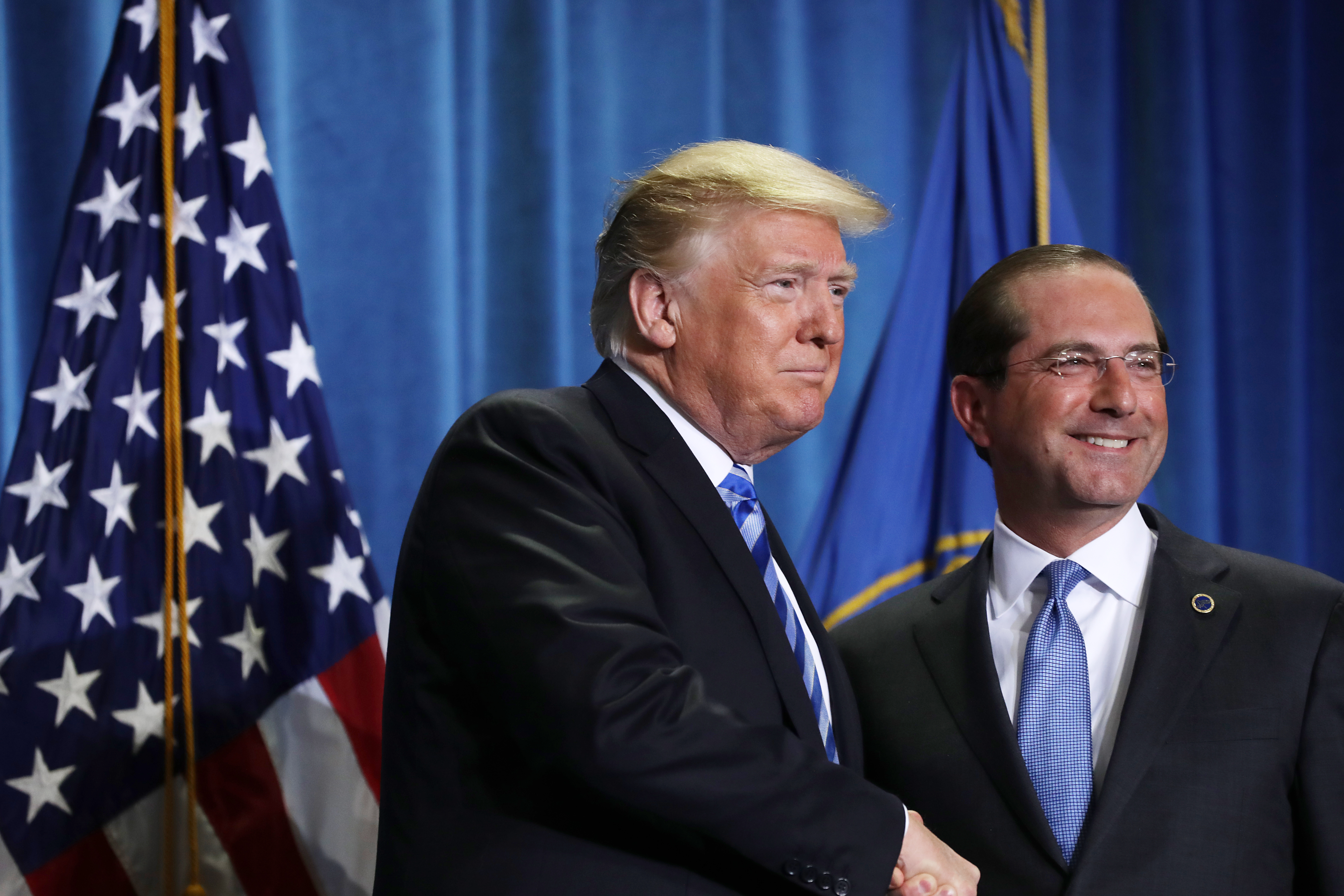 President Donald Trump shakes hands with Health and Human Services Secretary Alex Azar at HHS headquarters, October 25, 2018, Washington, D.C. (Photo Credit: Chip Somodevilla/Getty Images)