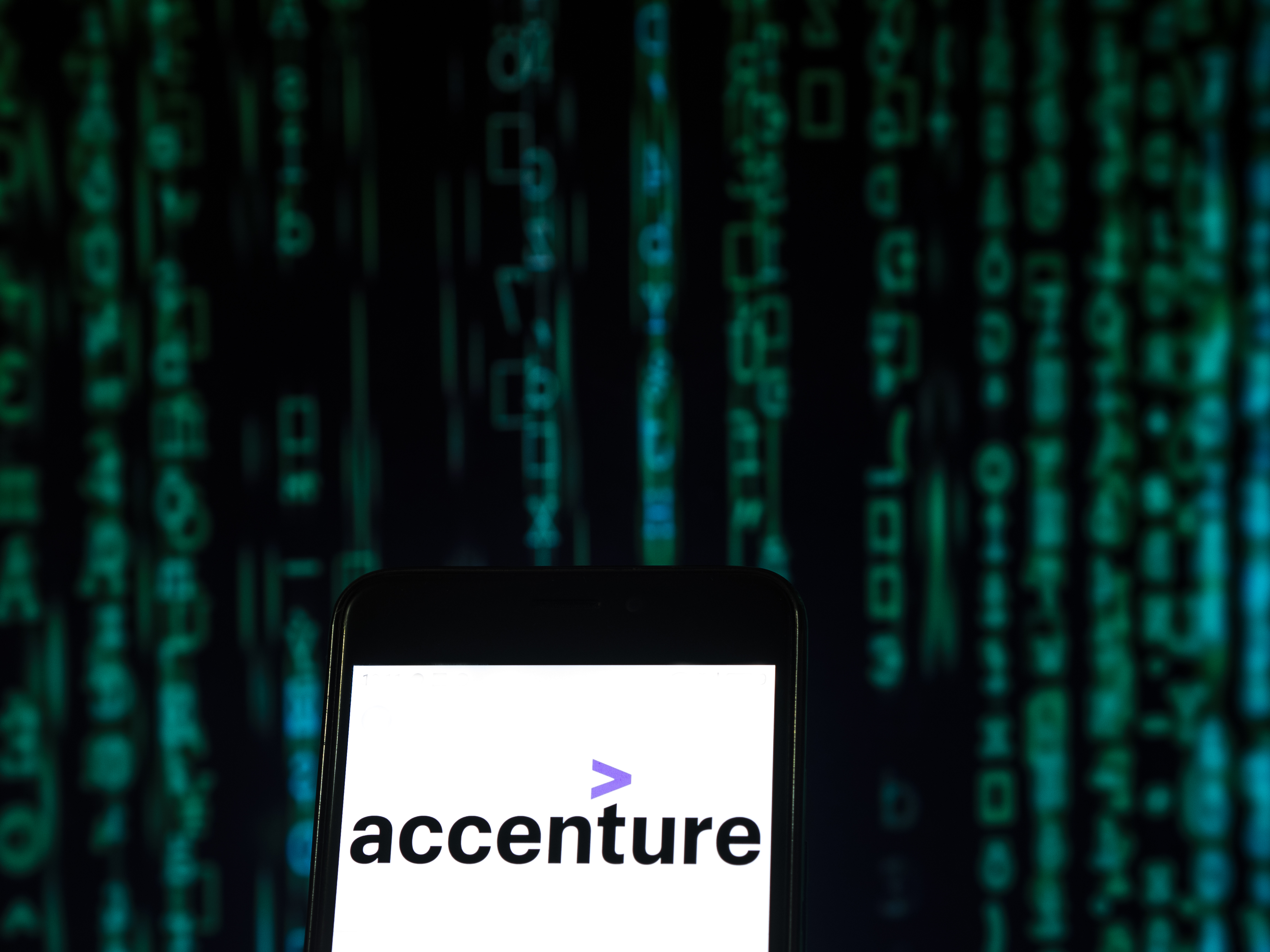 Accenture employees are putting together a petition to urge management to end its contract with the Trump administration. CREDIT: Igor Golovniov/SOPA Images/LightRocket via Getty Images