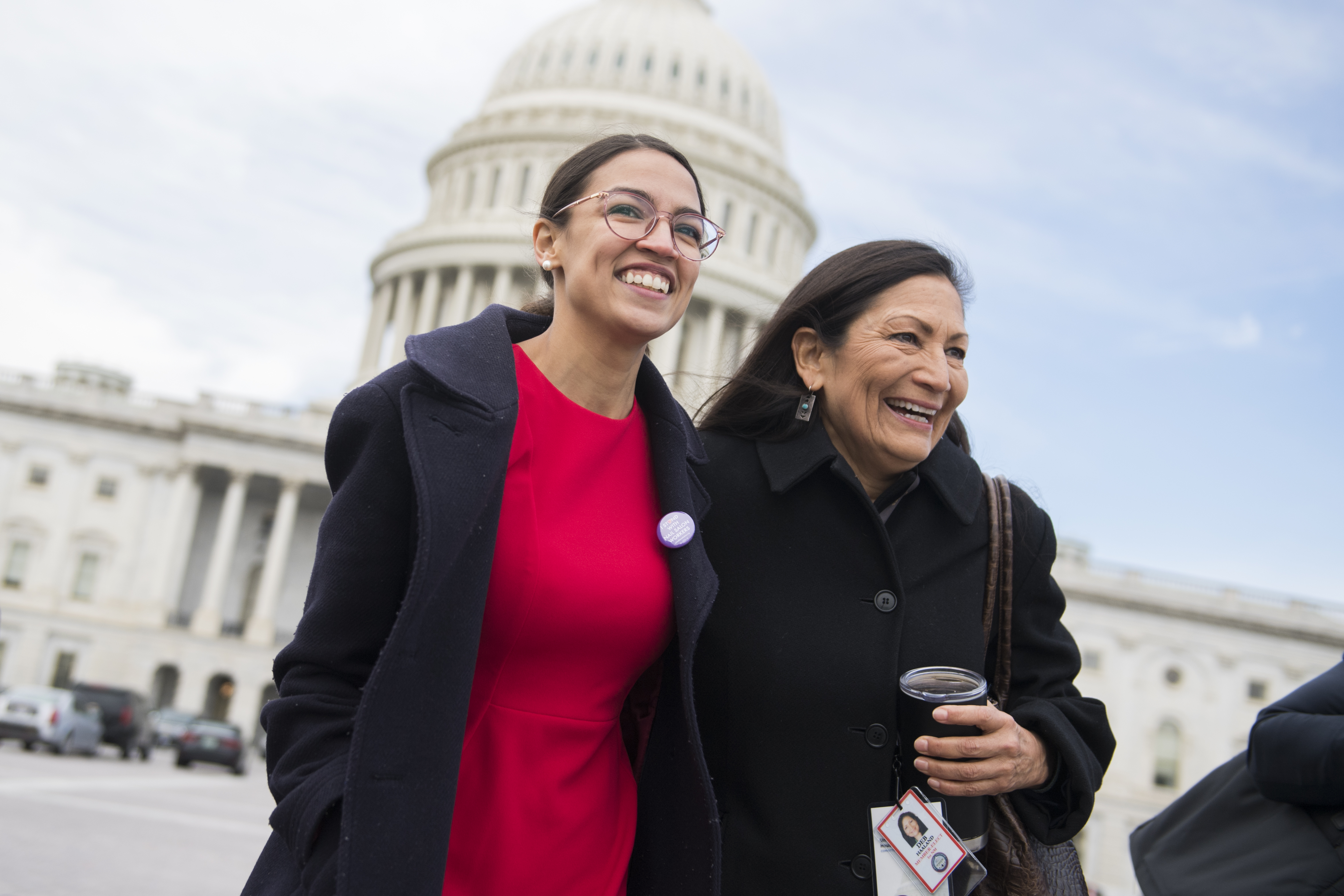 Members-elect Alexandria Ocasio-Cortez, D-N.Y., left, and Deb Haaland, D-N.M., are seen after the freshman class photo on the East Front of the Capitol on November 14, 2018. CREDIT: Tom Williams/CQ Roll Call