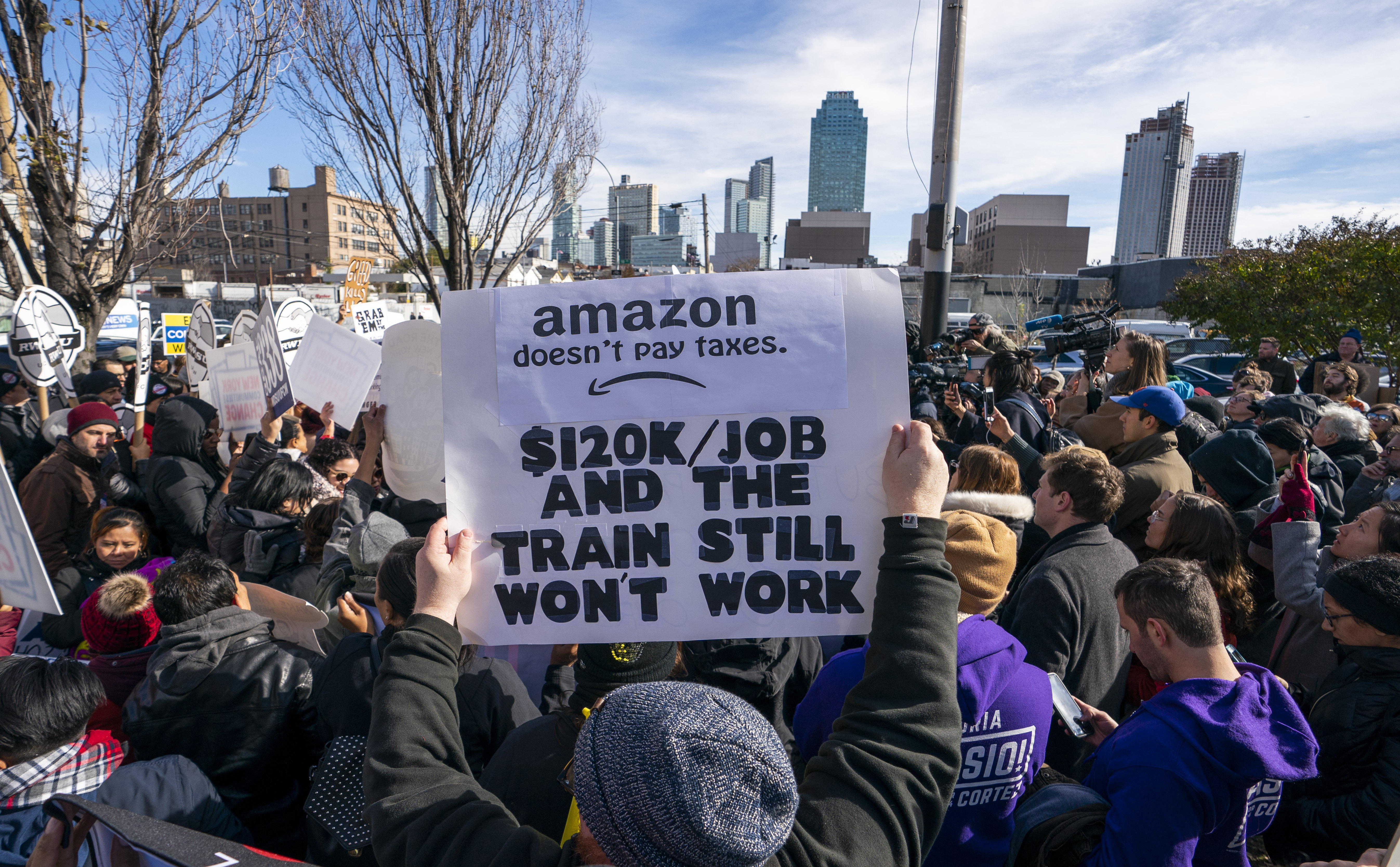 Protesters gather in Long Island City to say "No" to the Amazon "HQ2" decision on November 14, 2018 in Long Island City, New York. - It's exciting for some, worrisome for others: The arrival of a massive headquarters of technology giant Amazon in two East Coast communities is certain to bring huge changes.
Amazon announced Tuesday after a yearlong search that it would split its "HQ2" between Arlington, Virginia, outside the US capital, and the Long Island City neighborhood in the New York borough of Queens. (Photo by Don EMMERT / AFP) (Photo credit should read DON EMMERT/AFP/Getty Images)