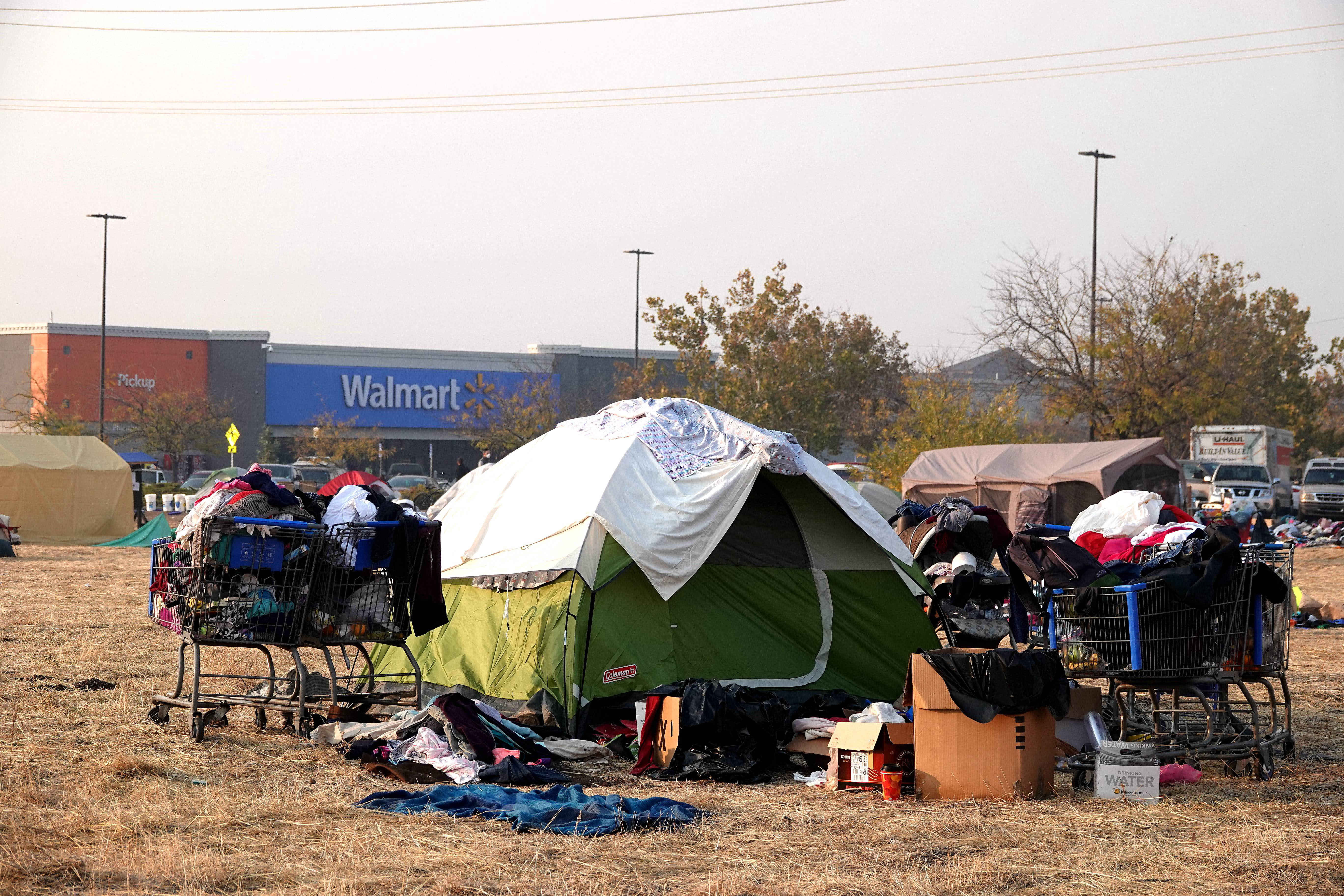 Victims of the Camp Fire live in tents at the parking area of Walmart in Chico of Butte County, California, the United States, Nov. 18, 2018. (Credit: Xinhua/Wu Xiaoling via Getty Images)