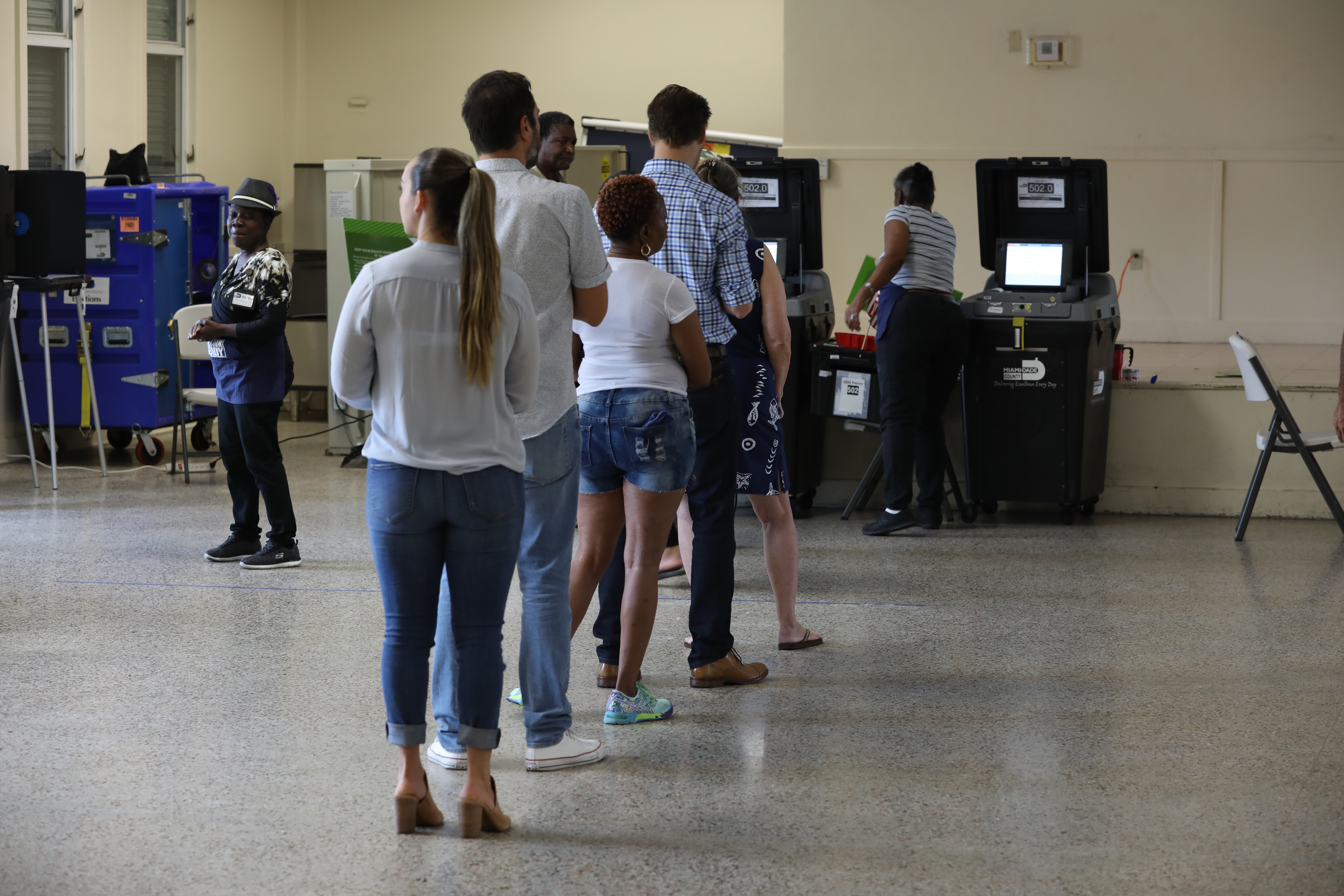 Voters line-up to cast their ballots at a polling station setup in Legion Park for the mid-term election on November 06, 2018 in Miami, Florida. (PHOTO CREDIT: Joe Raedle/Getty Images)