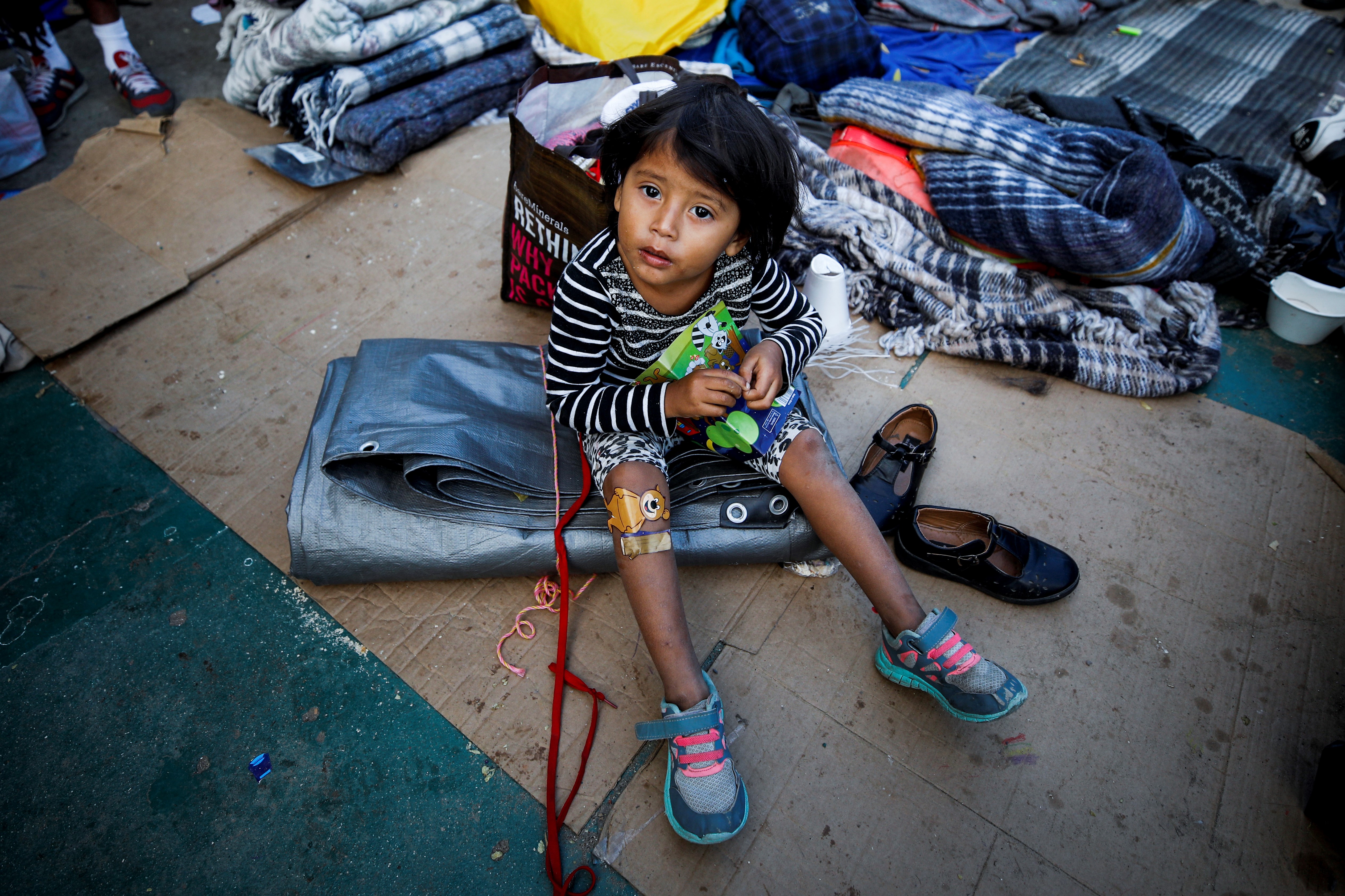A child is seen at the Benito Juarez Sports complex in Tijuana, Mexico on November 28, 2018. CREDIT: Atilgan Ozdil/Anadolu Agency/Getty Images.