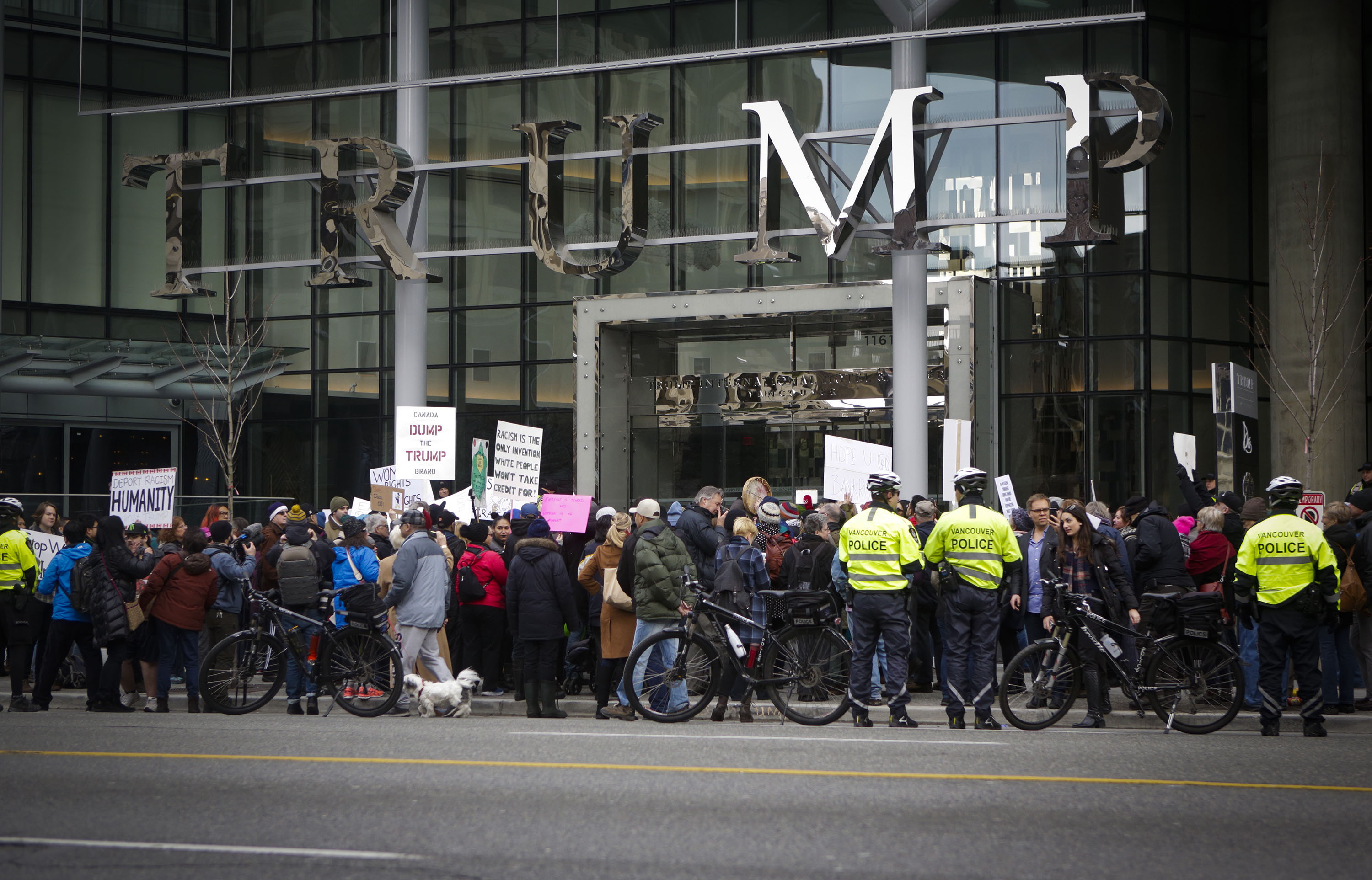 People protest outside the Trump International Hotel and Tower in Canada's Vancouver on Feb. 28, 2017, the building's official opening day. (Xinhua/Liang Sen via Getty Images)