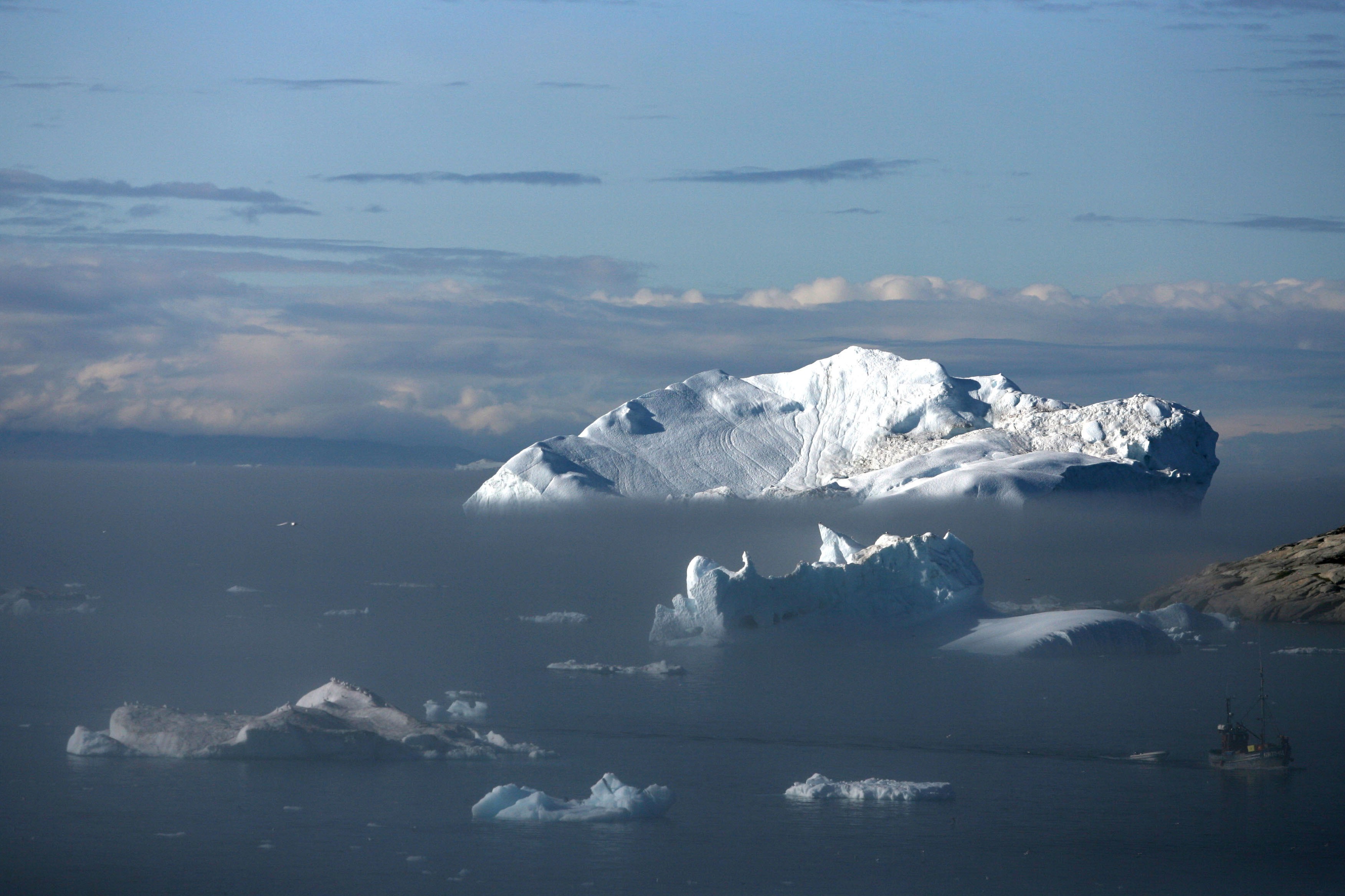 Icebergs float in the Jacobshavn Bay on August 24, 2007 near the town of Ilulissat, Greenland. CREDIT: Uriel Sinai/Getty Images