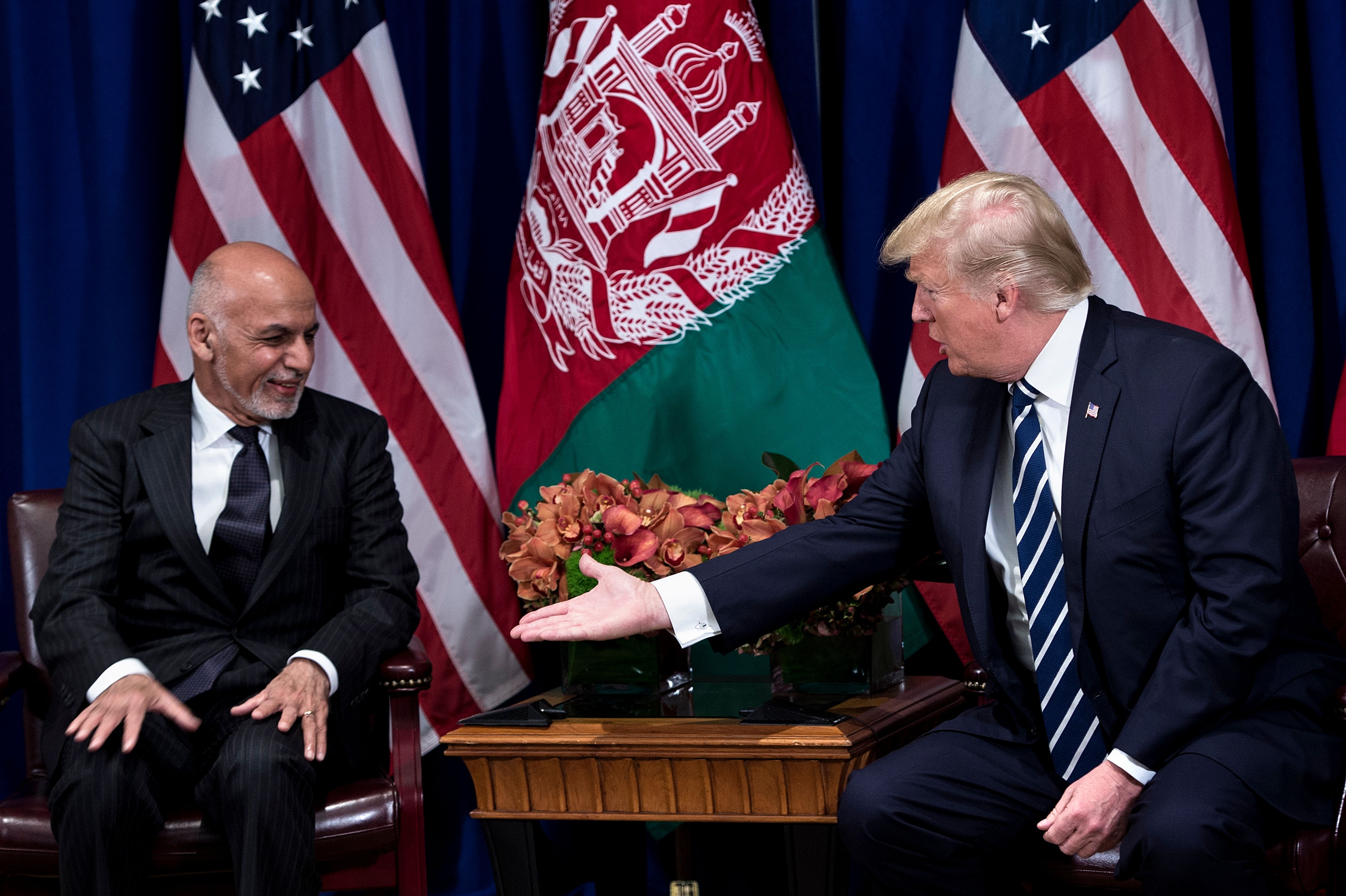 Afghan President Ashraf Ghani and US President Donald Trump shake hands before a meeting at the Palace Hotel during the 72nd United Nations General Assembly September 21, 2017 in New York City. (Credit: BRENDAN SMIALOWSKI/AFP/Getty Images)