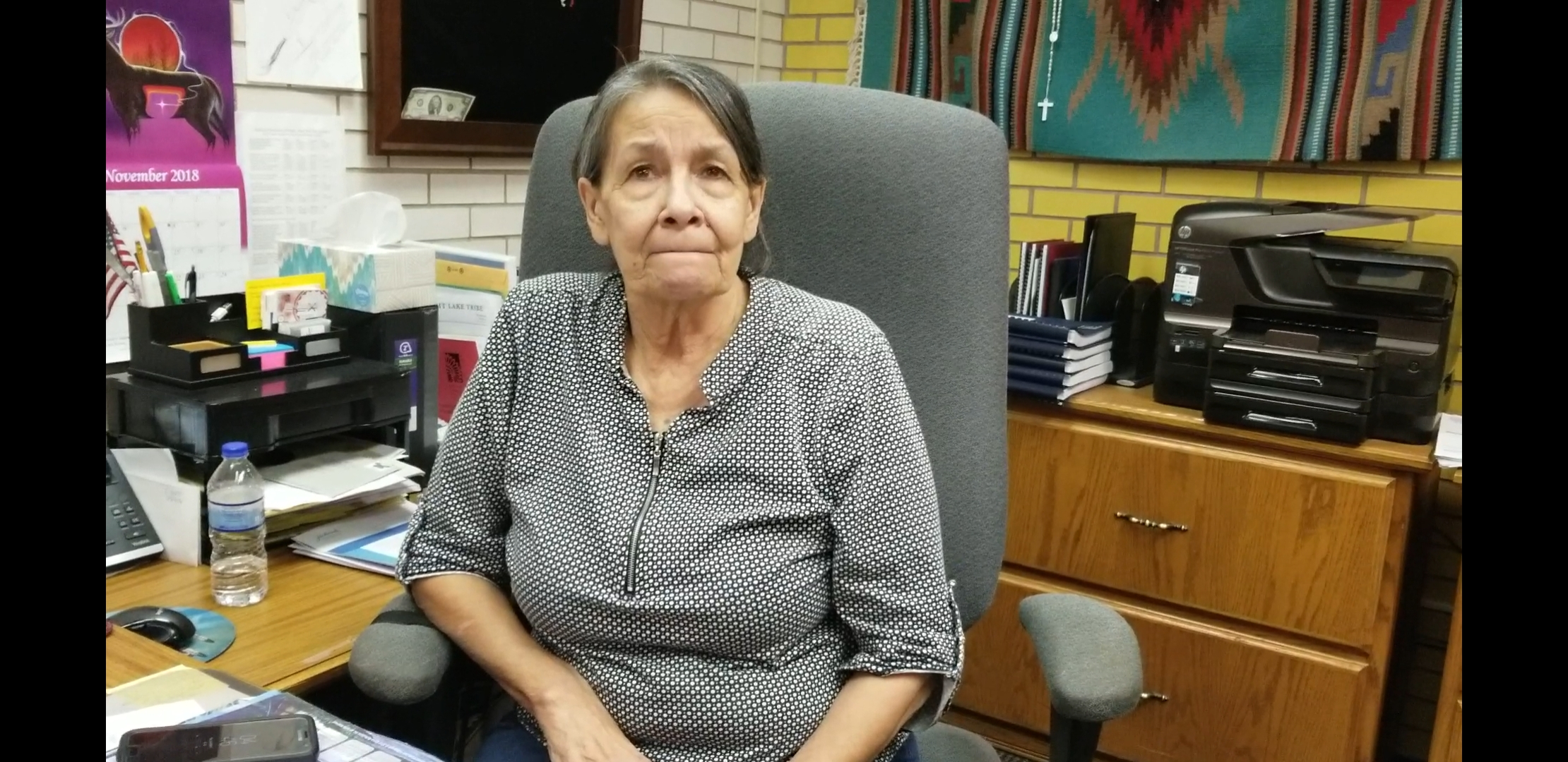 Myra Pearson, chair of Spirit Lake Nation at her desk at the tribe's enrollment office in Fort Totten, ND on Nov. 1, 2018. (Credit: Danielle McLean for ThinkProgress)