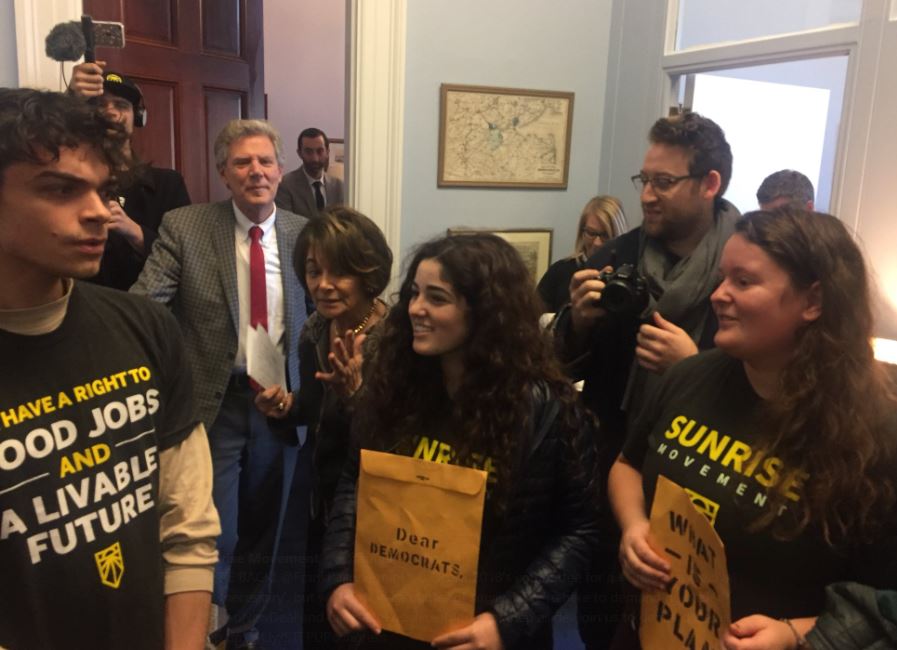 Demonstrators converged on the office of Rep. Frank Pallone (in background) on November 16, 2018 to urge him to support strong climate legislation. CREDIT: Sunrise Movement