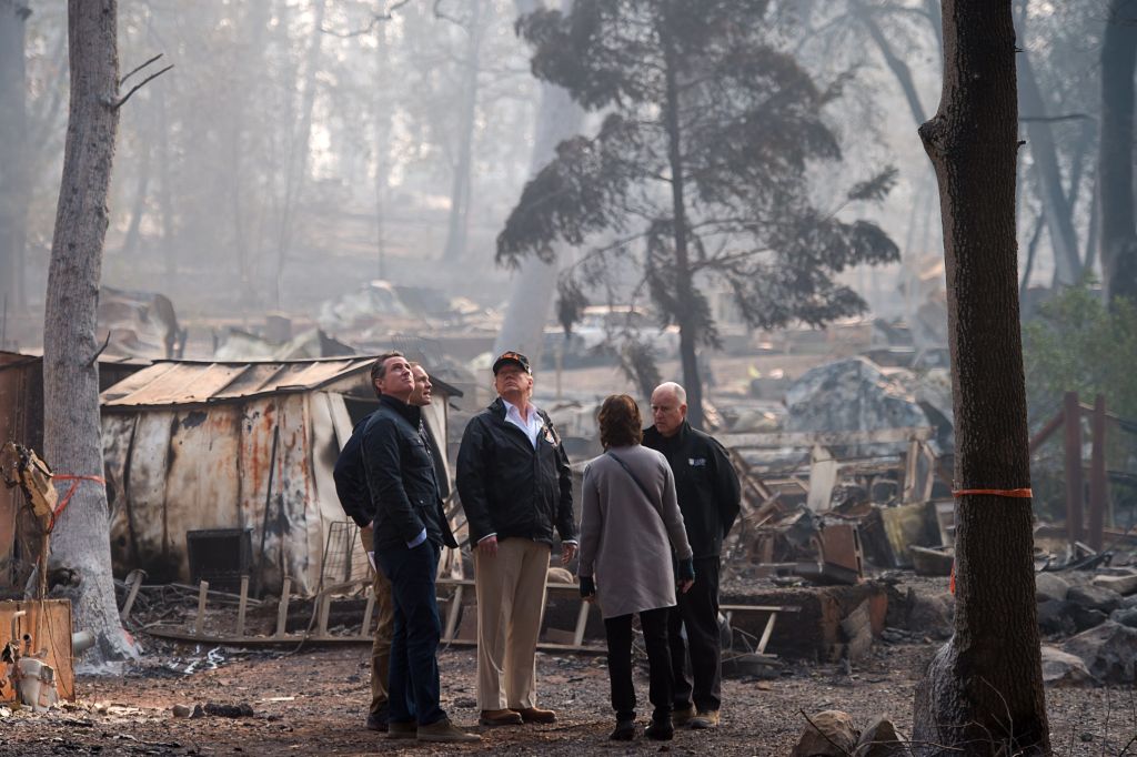 Gov.-elect Gavin Newson, FEMA Director Brock Long, President Donald Trump, Paradise mayor Jody Jones and Gov. Jerry Brown tour the Skyway Villa Mobile Home and RV Park, during Trump's visit of the Camp Fire in Paradise, California on November 17, 2018. (Credit: Paul Kitagaki Jr.-Pool/Getty Images)
