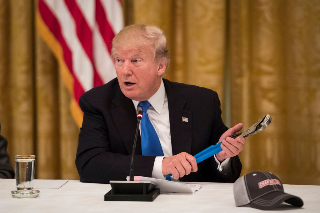 Donald Trump holds a pair of pliers in the White House on July 19, 2017. (Jabin Botsford/The Washington Post via Getty Images)