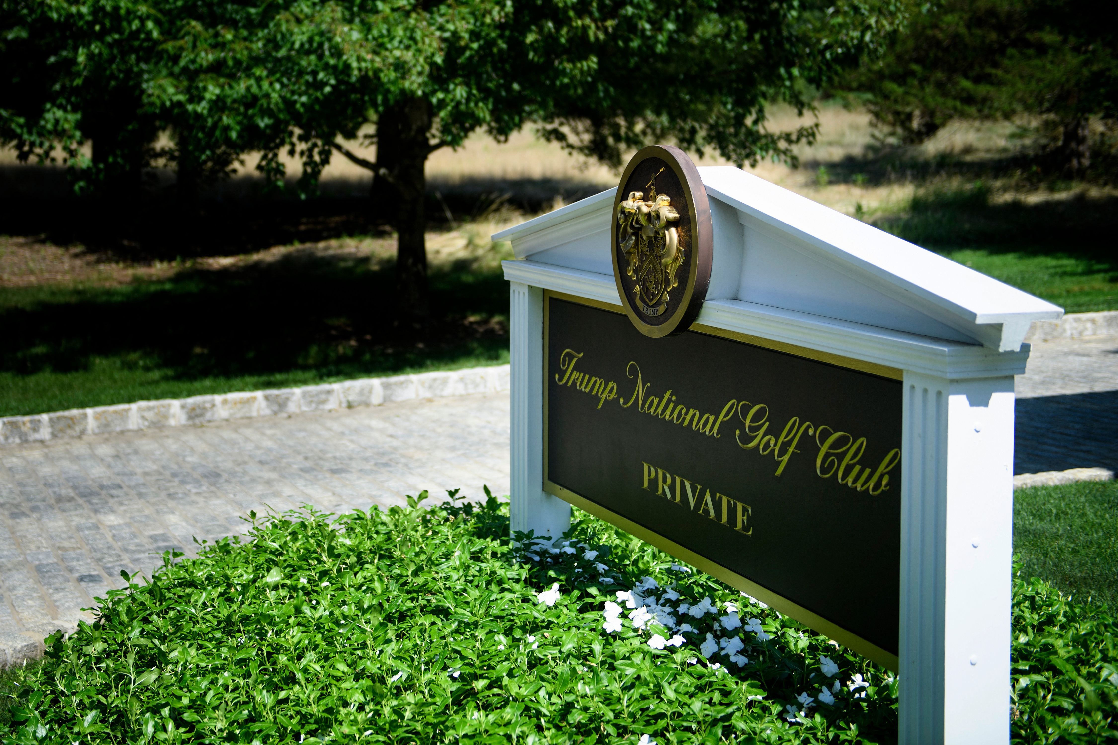 A sign is seen at an entrance to the Trump National Golf Club August 9, 2018 in Bedminster, New Jersey. CREDIT: BRENDAN SMIALOWSKI/AFP/Getty Images