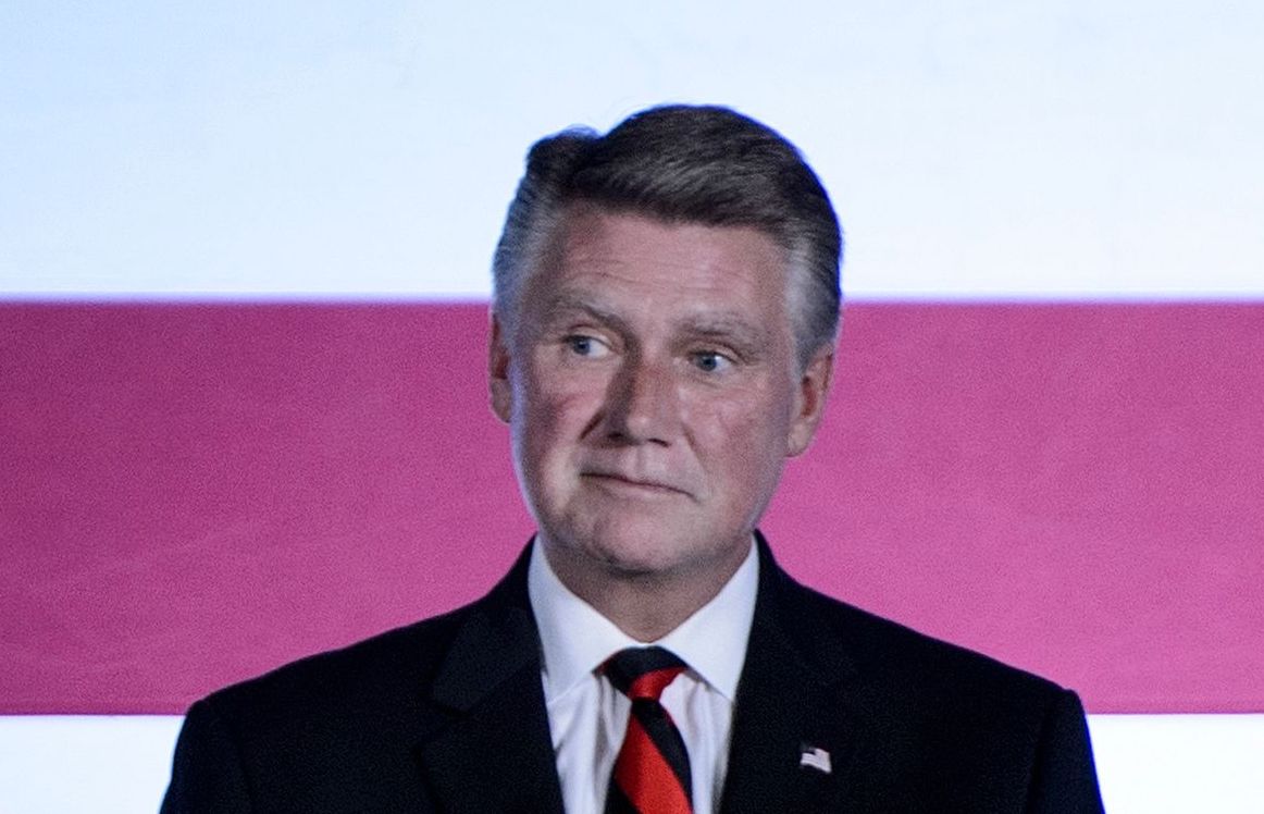 US House candidate Mark Harris (R-NC) listens to US President Donald Trump talk during a fundraiser at the Carmel Country Club August 31, 2018 in Charlotte, North Carolina. Credit: Brendan Smialowski / AFP