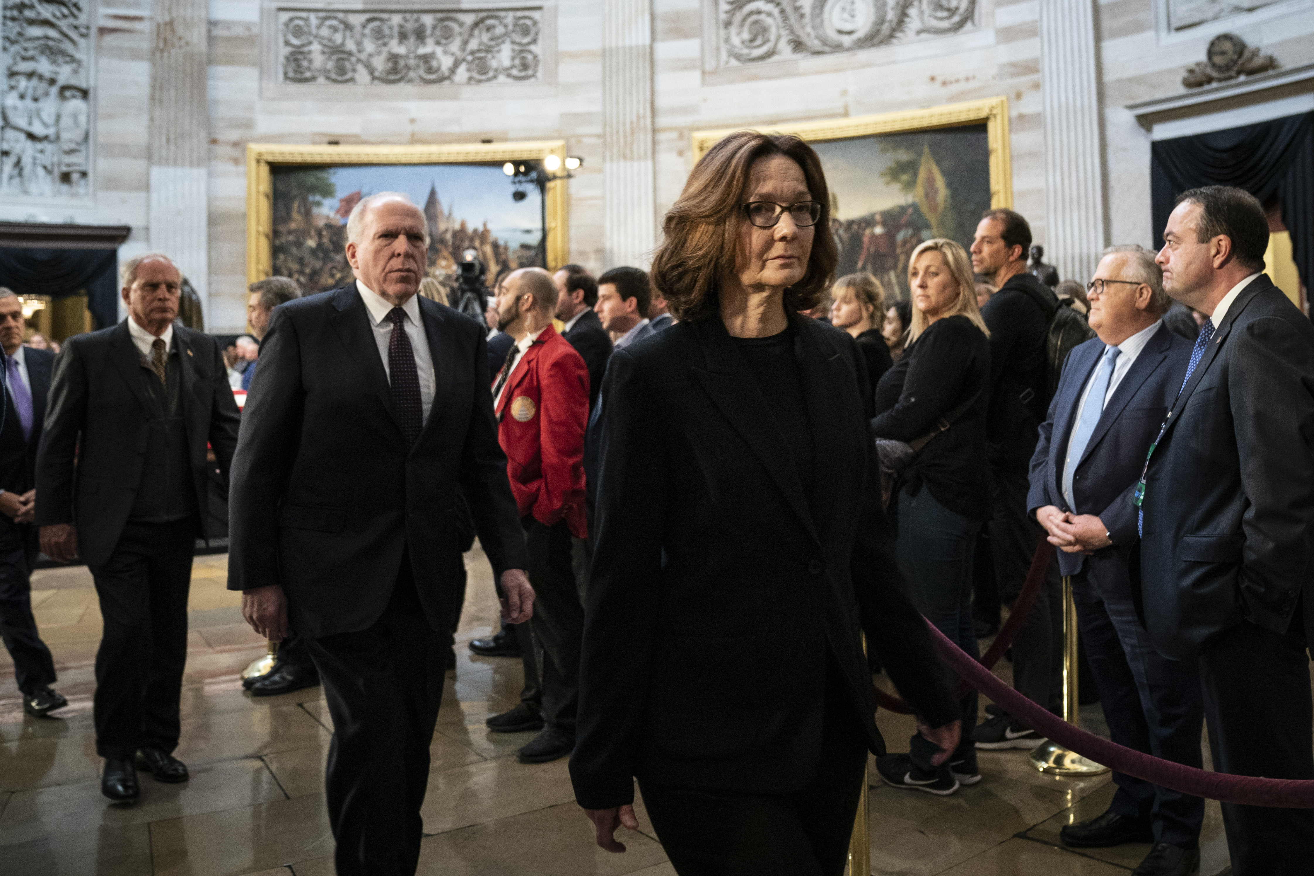 CIA Director Gina Haspel depart after paying their respects at the casket of the late former President George H.W. Bush at the U.S. Capitol, December 4, 2018 in Washington, DC. Haspel testified before a select group of senators on her agency's report on the murder of Jamal Khashoggi later in the day. CREDIT: Drew Angerer/Getty Images.