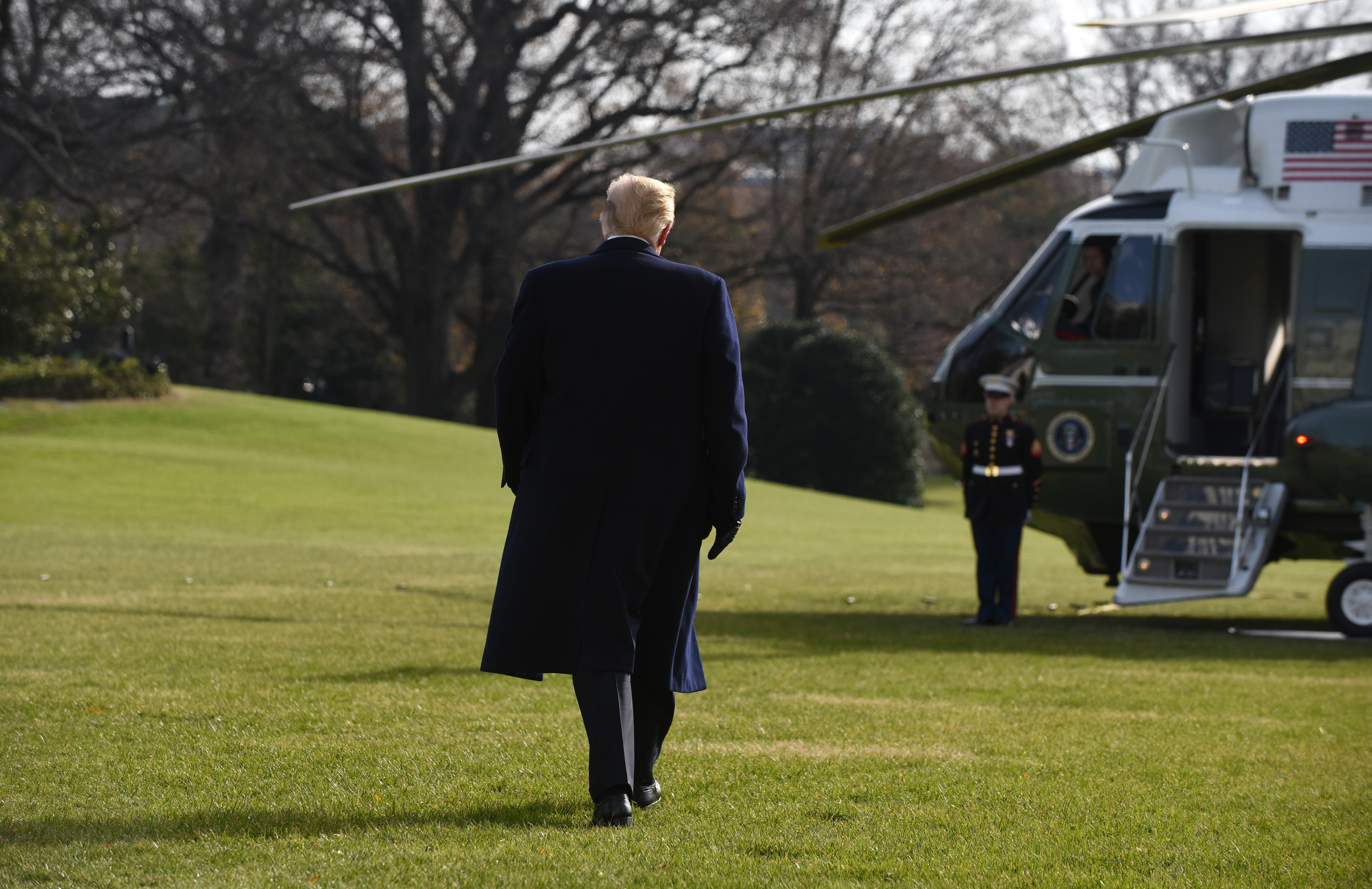 WASHINGTON, DC - DECEMBER 8: (AFP OUT) U.S. President Donald Trump walks towards the press while departing the White House December 8, 2018 in Washington, DC. Trump says White House chief of staff John Kelly will resign by the end of the year before departing for the 119th Army-Navy Football Game in Philadelphia, PA. (Photo by Olivier Douliery-Pool/Getty Images)