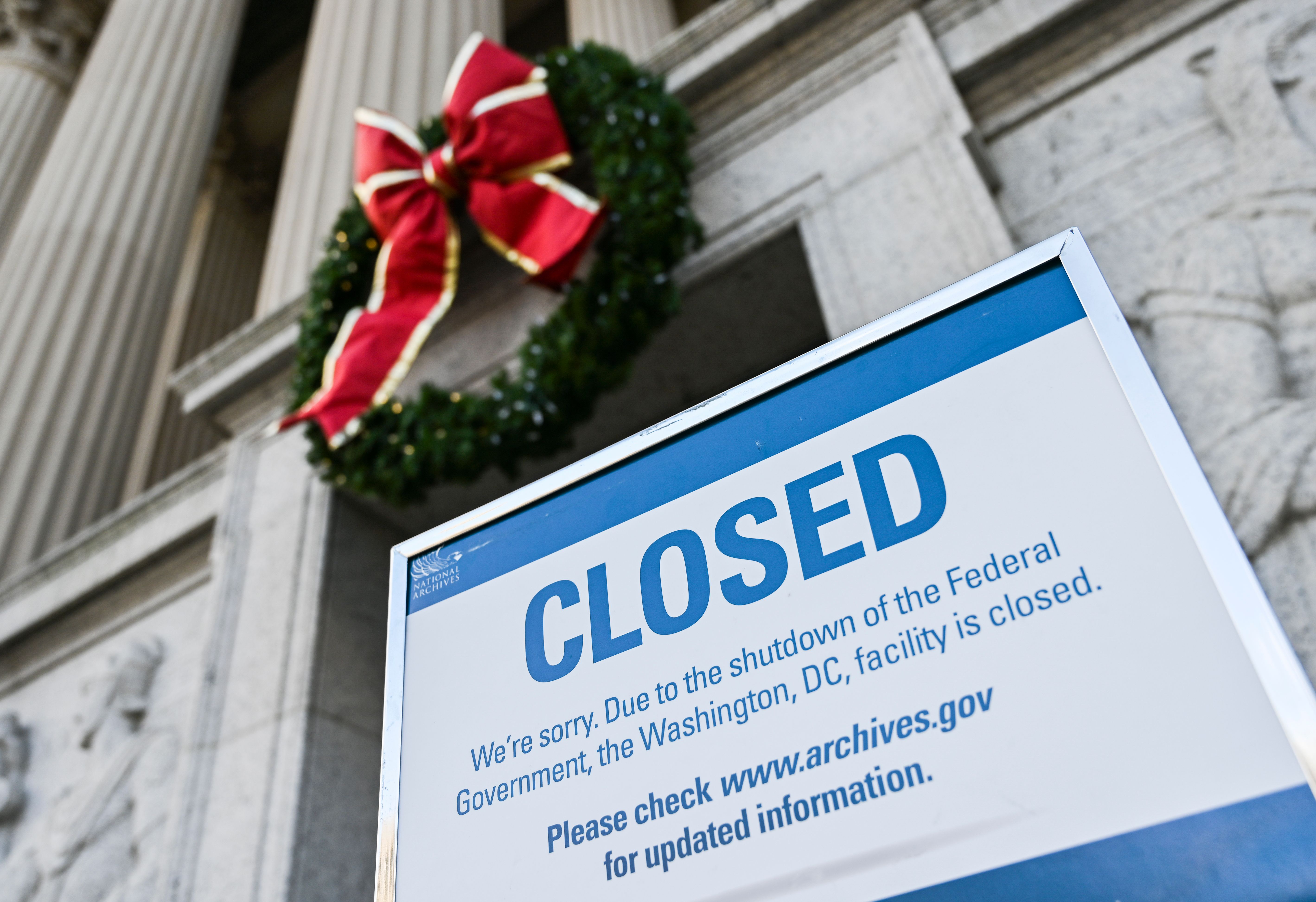 A sign at the National Archives, in Washington, D.C., announces that the building is closed because of a government shutdown that is set to stretch on through Christmas and possibly into the new year. CREDIT: ANDREW CABALLERO-REYNOLDS/AFP/Getty Images