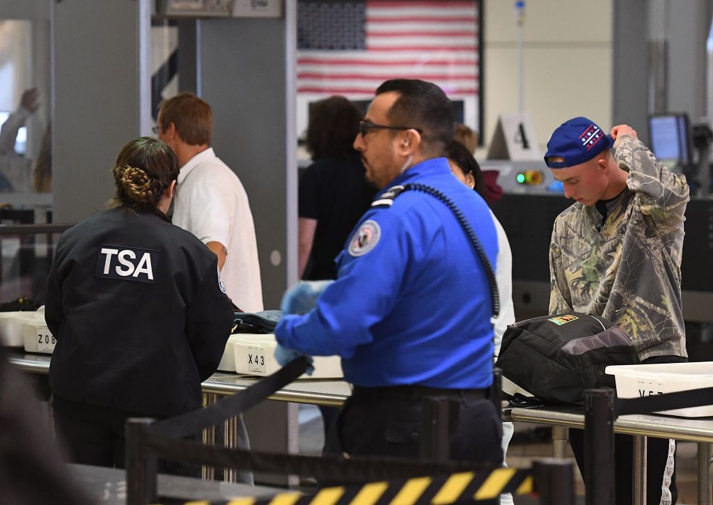 Government workers have begun expressing concern that the ongoing government shutdown may continue well into 2019. The shutdown first began on December 21, after Republicans, intent on supporting President Trump's $5 billion border wall request, and Democrats were unable to reach a compromise to keep the government funded. (Photo credit: MARK RALSTON/AFP/Getty Images)