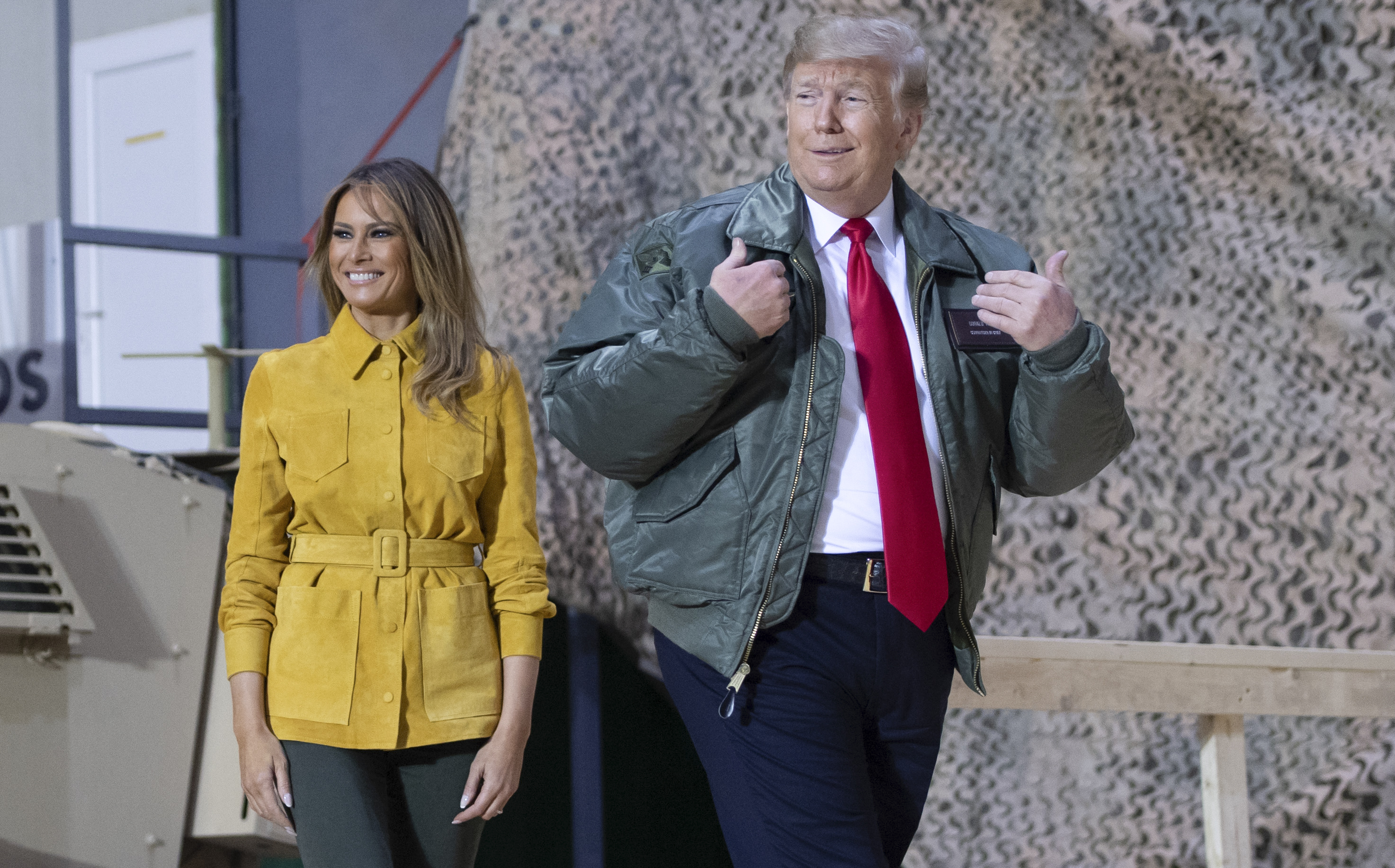 President Donald Trump and First Lady Melania Trump arrive to speak to members of the US military during an unannounced trip to Al Asad Air Base in Iraq on December 26, 2018. (CREDIT: Saul Loeb/ AFP/Getty Images)