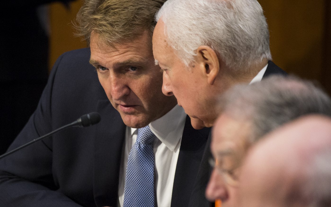 Sen. Jeff Flake (R-AZ) , left, spoke with Sen. Orrin Hatch (R-UT) in 2013.