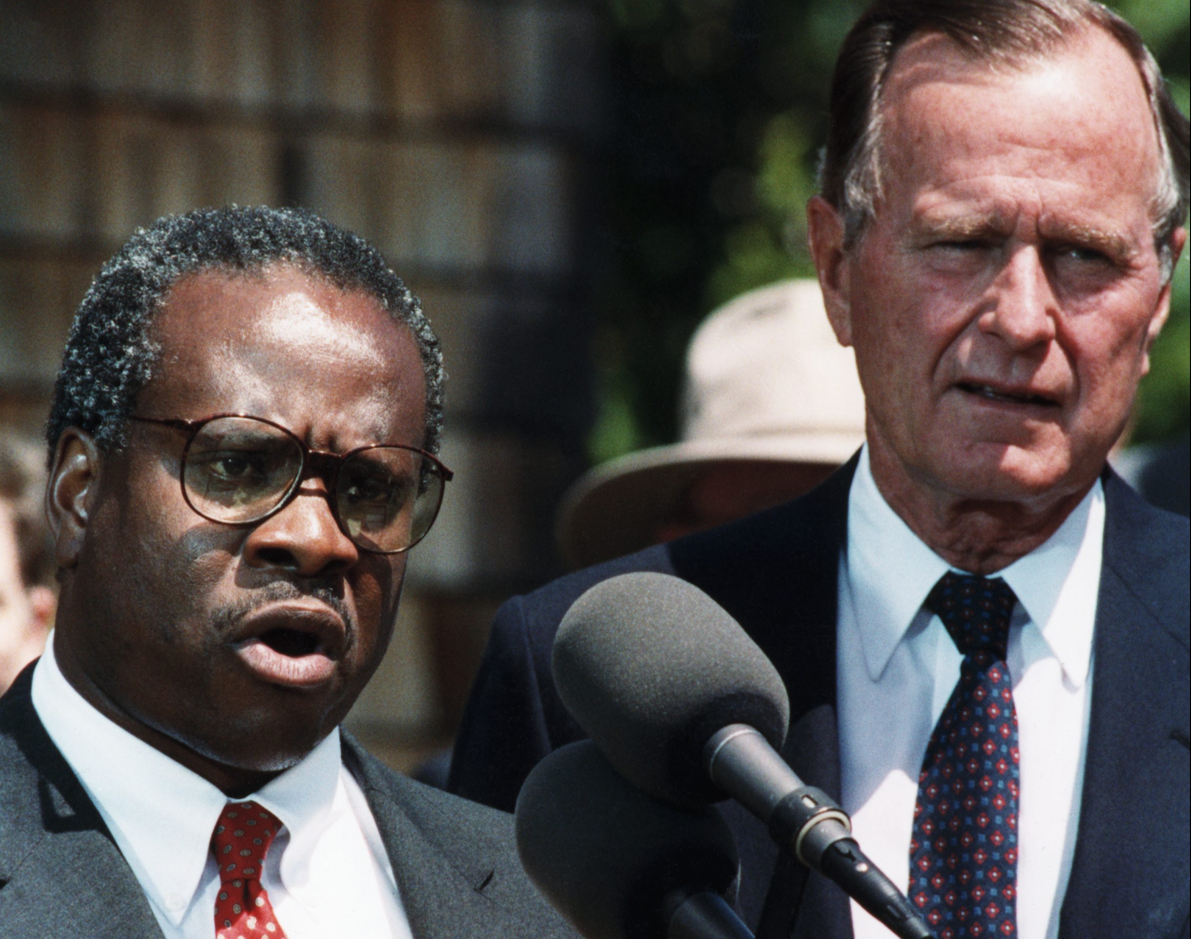 7/1/1991-Kennebunkport, Maine: President Bush looks on as Judge Clarence Thomas speaks with reporters about his nomination to the Supreme Court.