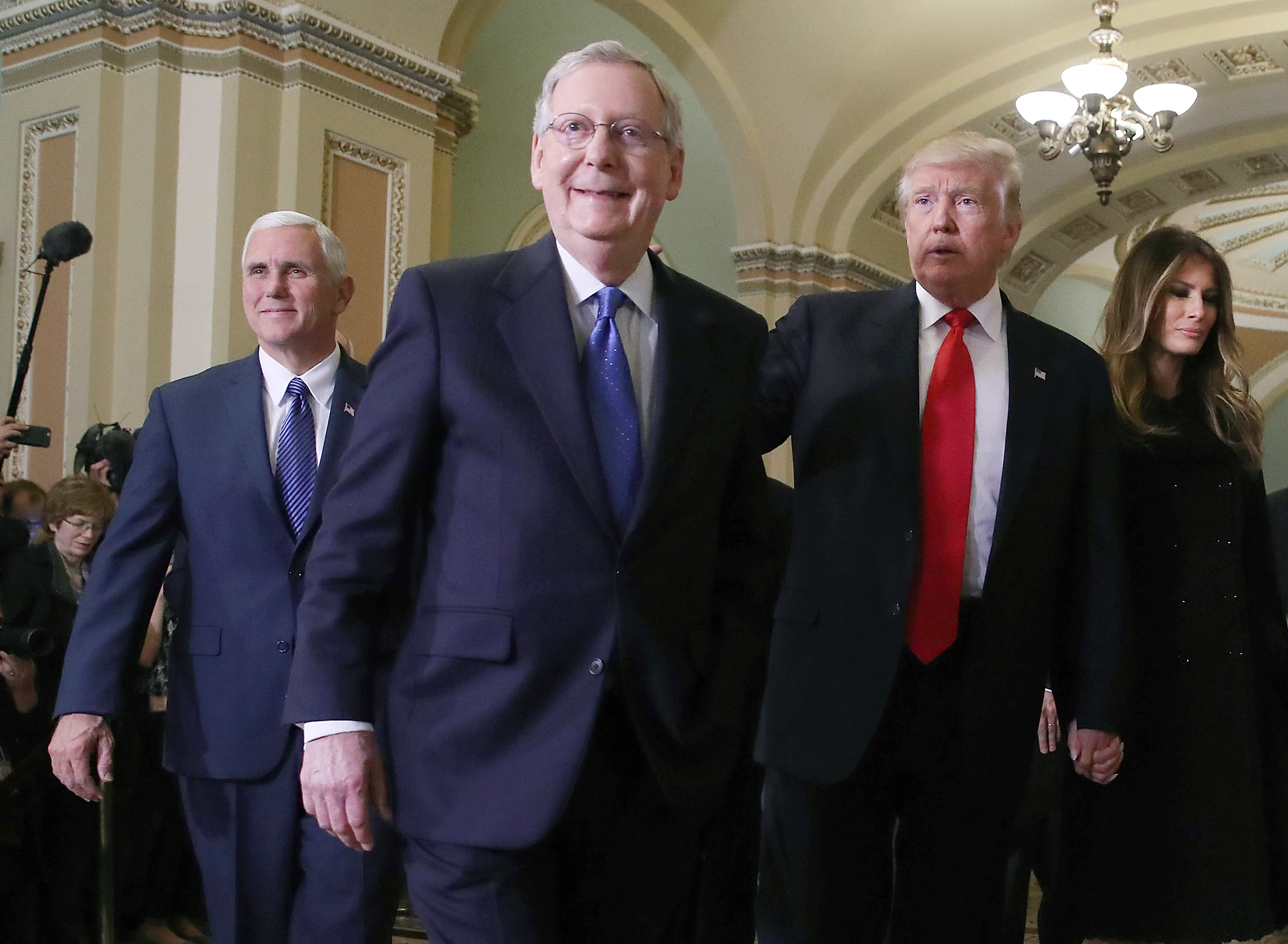 WASHINGTON, DC - NOVEMBER 10: Senate Majority Leader Mitch McConnell (2L), walks with President-elect Donald Trump, his wife Melania Trump, and Vice President-elect Mike Pence (L), at the U.S. Capitol for a meeting November 10, 2016 in Washington, DC. Earlier in the day president-elect Trump met with U.S. President Barack Obama at the White House. (Photo by Mark Wilson/Getty Images)
