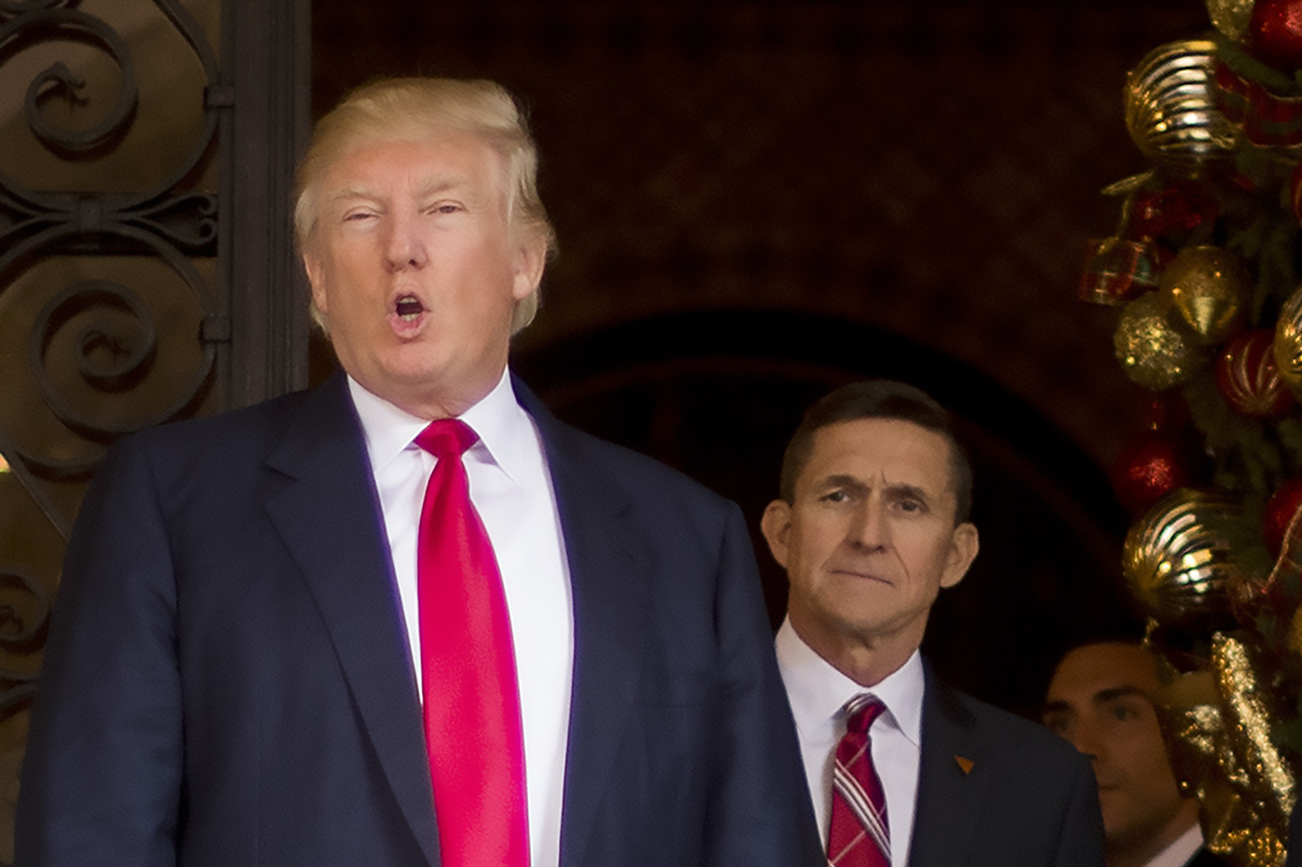 This December 21, 2016 file photo shows US President-elect Donald Trump (L) with his then National Security Adviser designate Lt. General Michael Flynn (R) at Mar-a-Lago in Palm Beach, Florida.
(CREDIT: JIM WATSON/AFP/Getty Images)