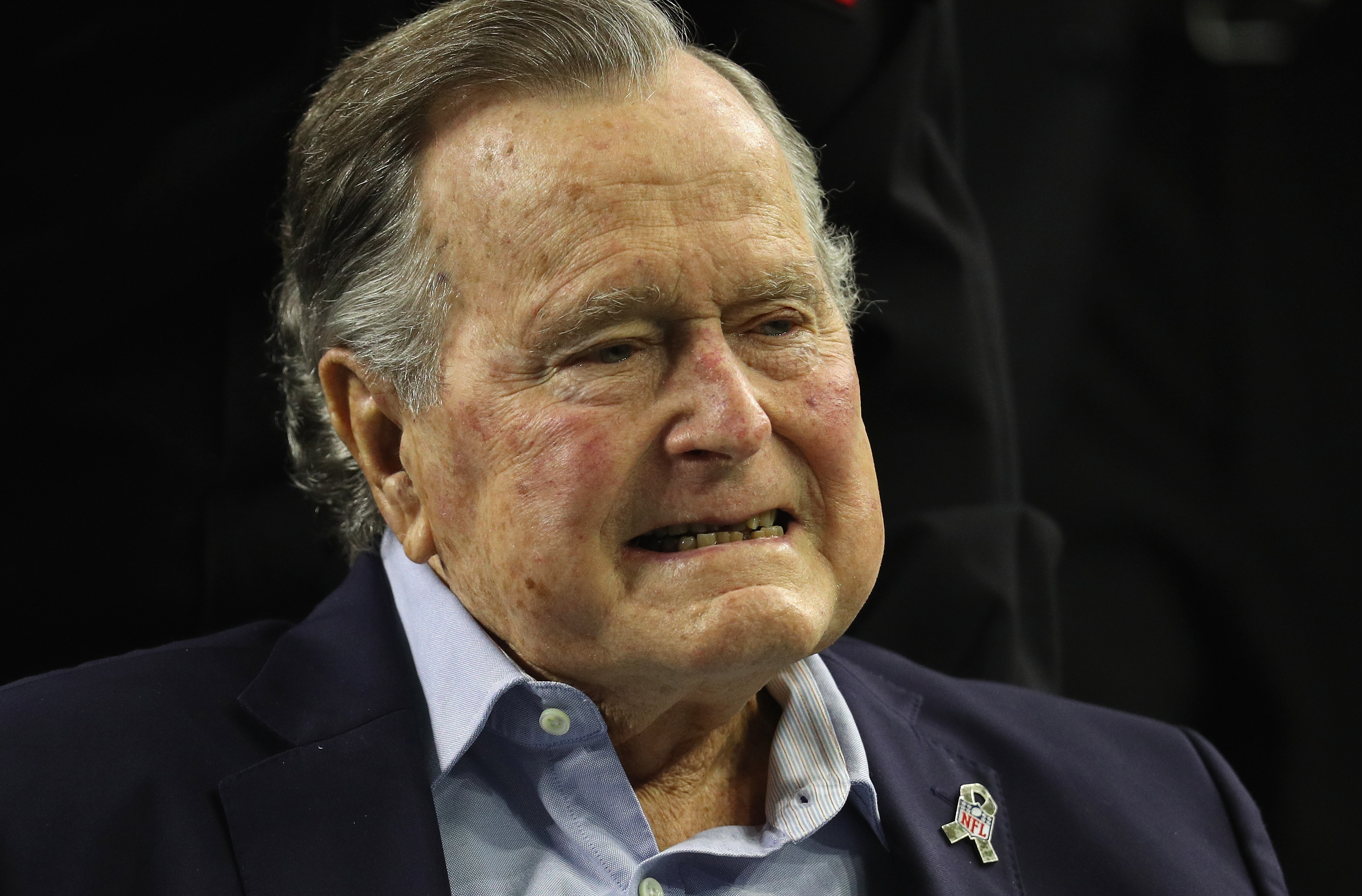President George H.W. Bush arrives for the coin toss prior to Super Bowl 51 between the Atlanta Falcons and the New England Patriots in Houston, Texas last year. CREDIT: Patrick Smith/Getty Images