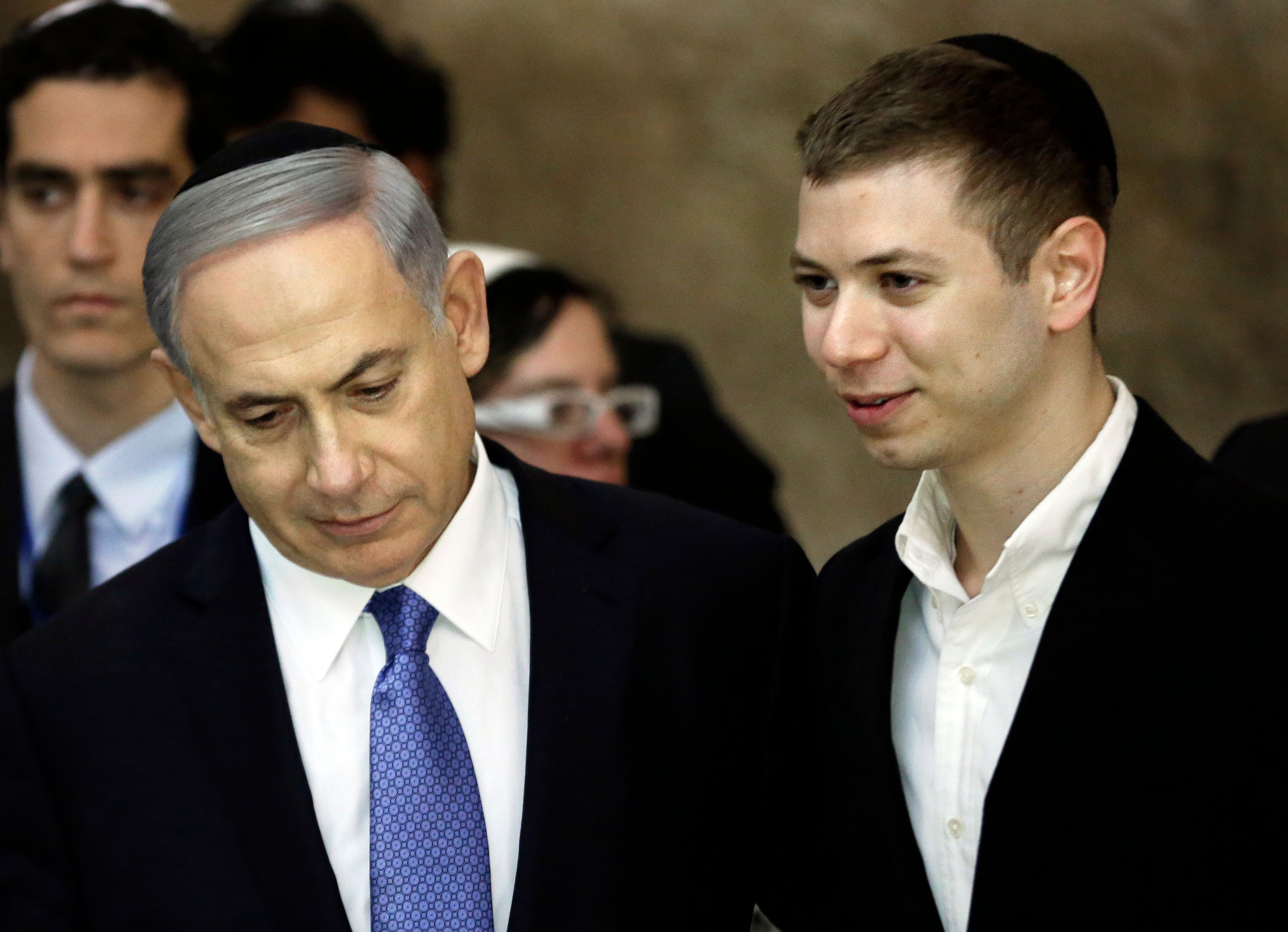 A picture taken on March 18, 2015 shows Israeli Prime Minister Benjamin Netanyahu (L) and his son Yair visiting the Wailing Wall in Jerusalem.
The son of Israeli Prime Minister Benjamin Netanyahu faced online criticism on September 9, 2017 after sharing an image on his Facebook page deemed anti-Semitic by critics. / AFP PHOTO / THOMAS COEX (Photo credit should read THOMAS COEX/AFP/Getty Images)