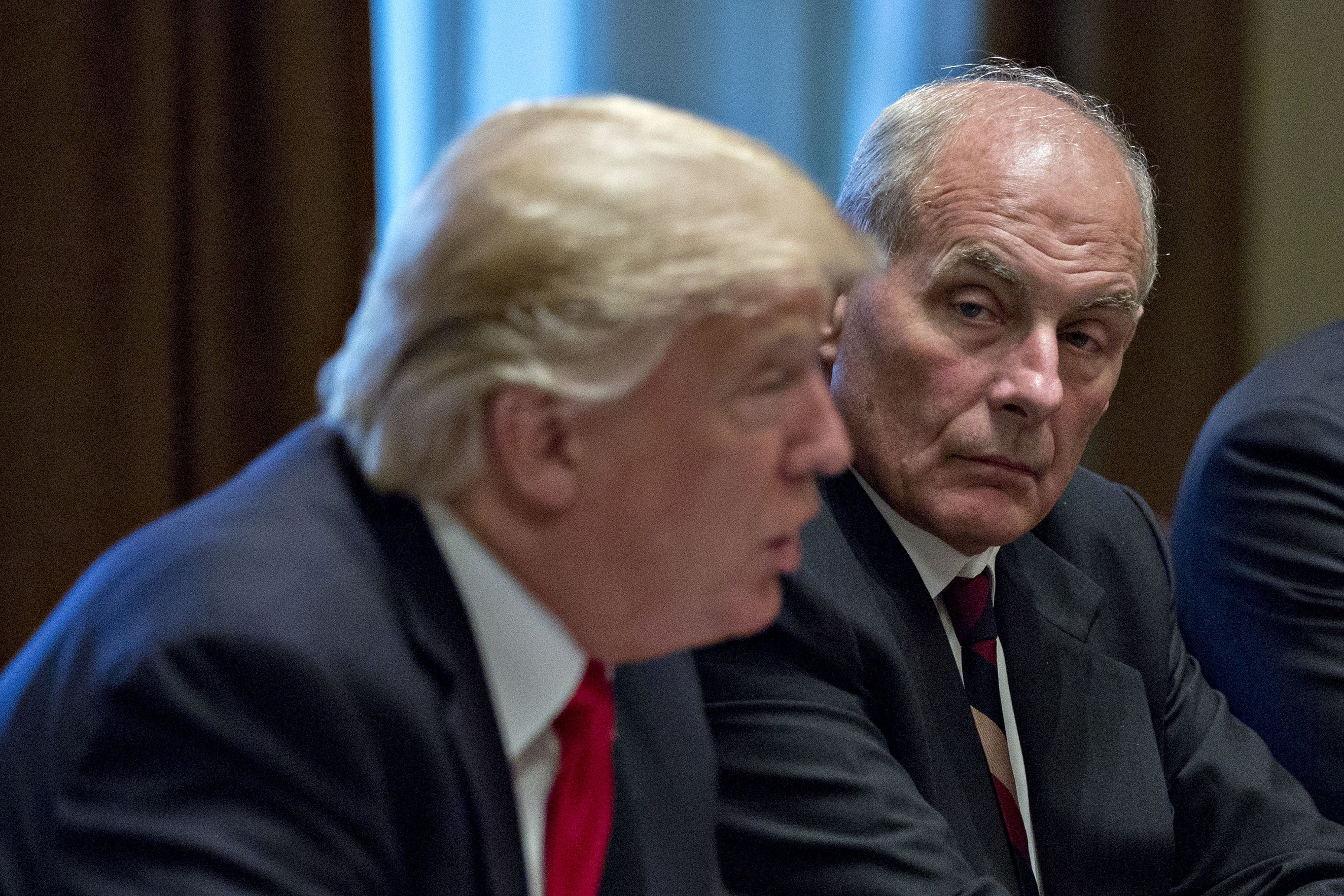 WASHINGTON, DC - OCTOBER 5: White House chief of staff John Kelly listens as U.S. President Donald Trump speaks at a briefing with senior military leaders in the Cabinet Room of the White House October 5, 2017 in Washington, D.C. (CREDIT: Andrew Harrer-Pool/Getty Images)