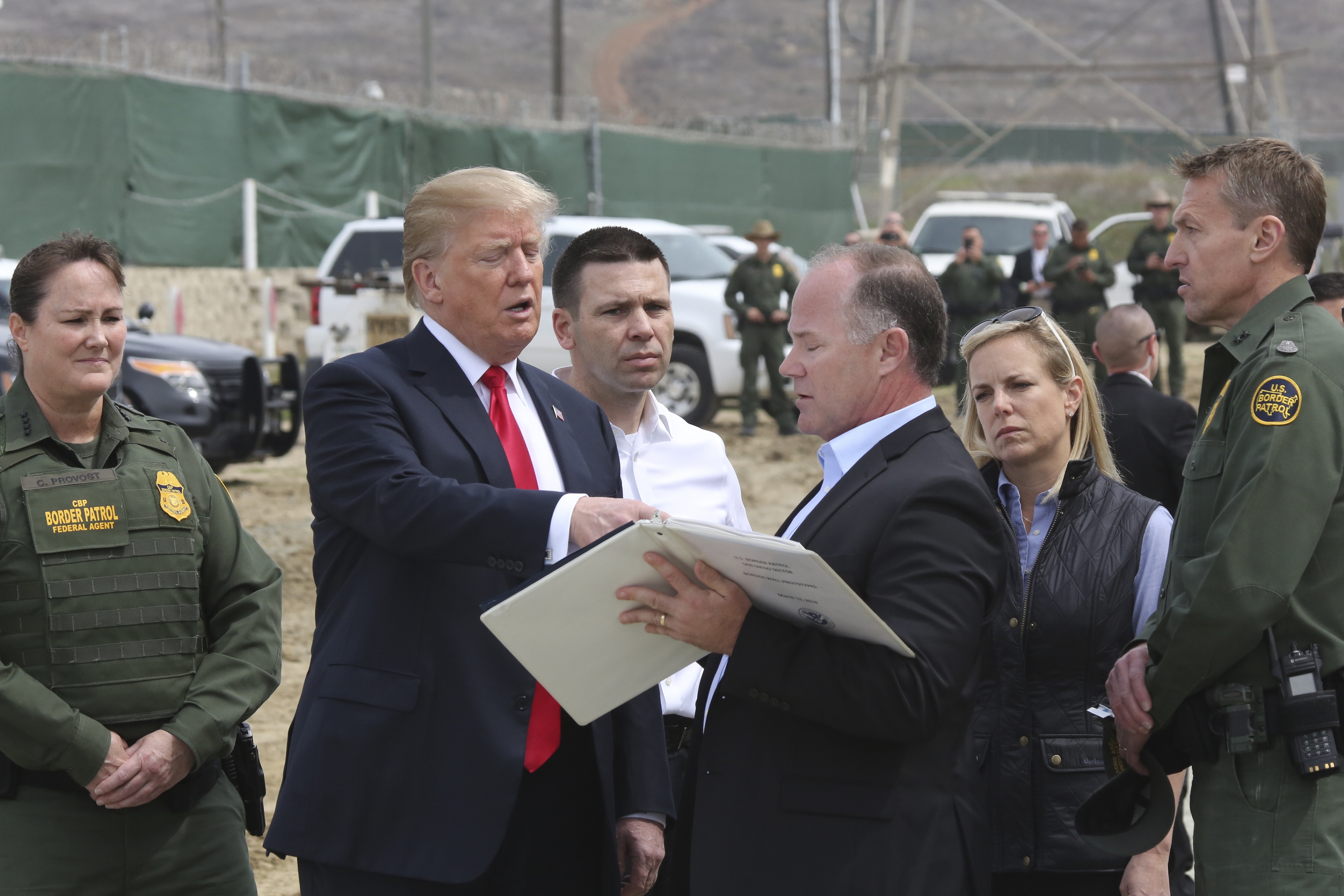 Project Manager James O'Loughlin explaining Border Wall prototypes to President Donald J Trump, accompanied with DHS Secretary Kirstjen Nielsen, CBP Acting Commissioner Kevin McAleenan, and San Diego Sector Chief Patrol Agent Rodney Scott, San Diego, March 13, 2018. Image courtesy Ralph Desio / United States Department of Defense. (Photo by Smith Collection/Gado/Getty Images)