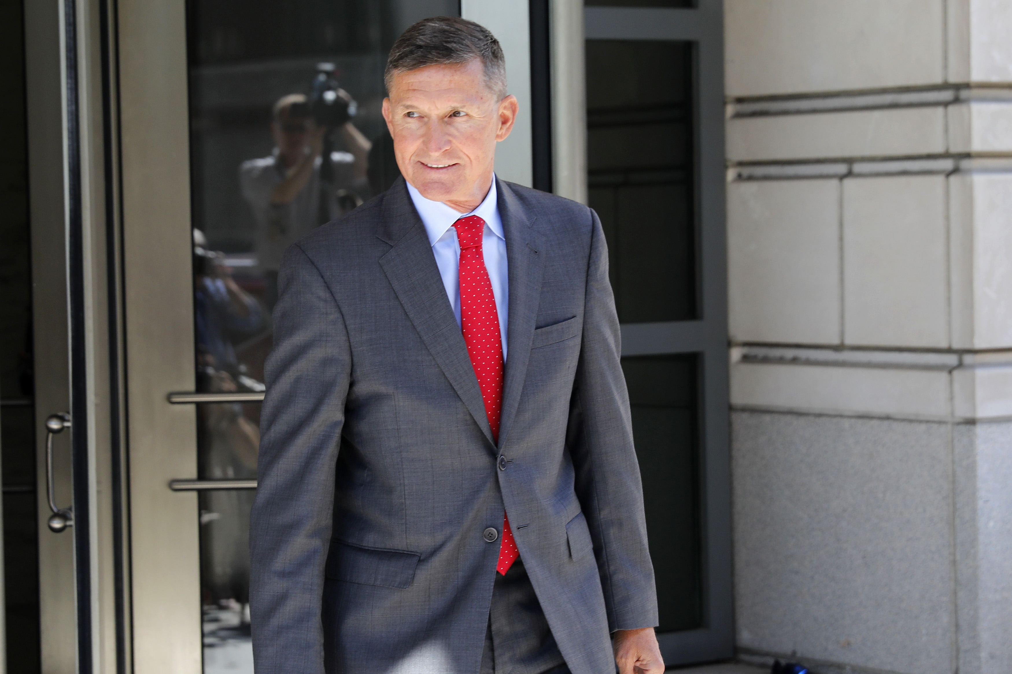 WASHINGTON, DC - July 10: Michael Flynn, former National Security Advisor to President Donald Trump, departs the E. Barrett Prettyman United States Courthouse following a pre-sentencing hearing July 10, 2018 in Washington, DC. Flynn has been charged with a single count of making a false statement to the FBI by Special Counsel Robert Mueller. (Photo by Aaron P. Bernstein/Getty Images)