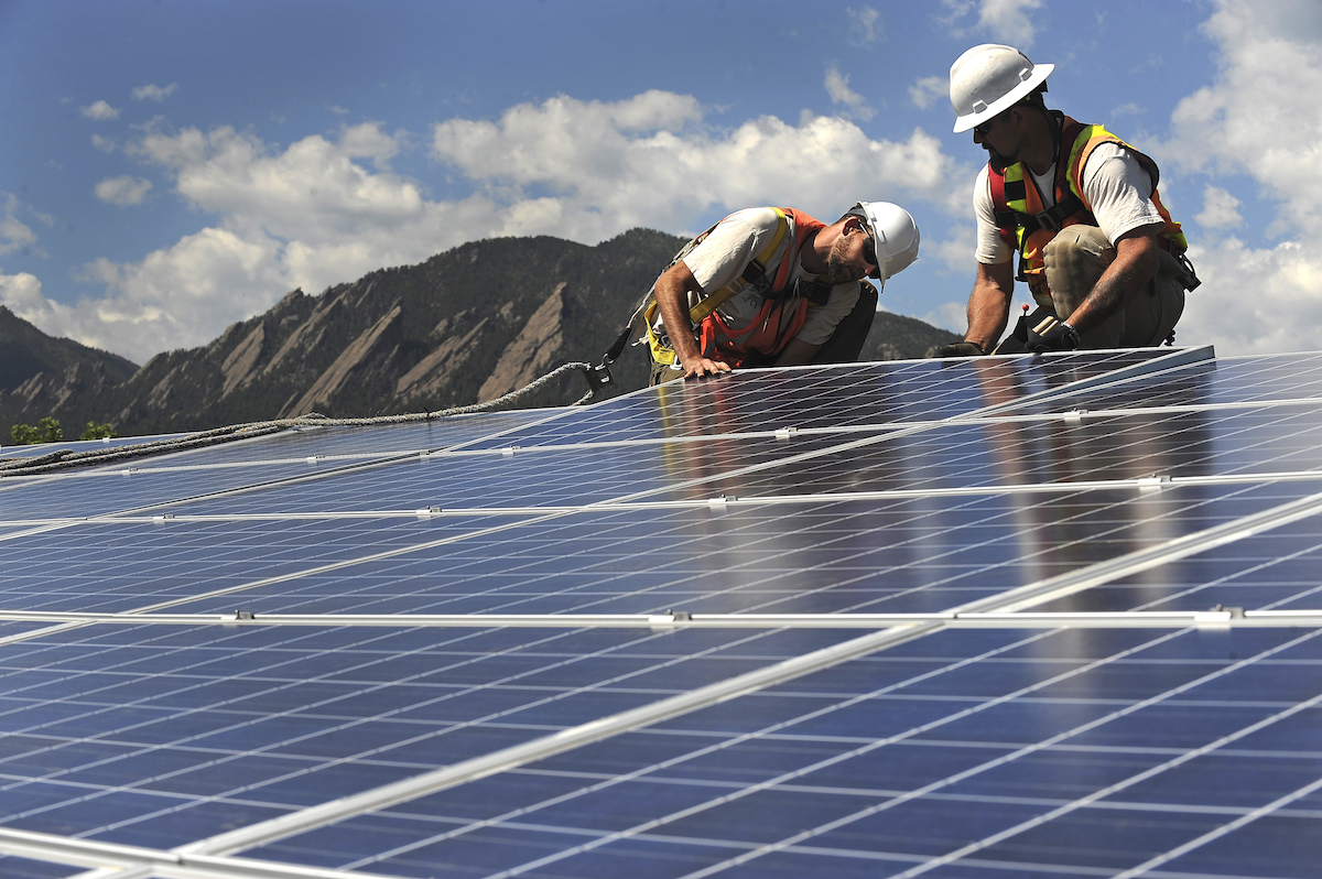 Solar panels being installed in Boulder, CO, June 2011. CREDIT: Helen Richardson/The Denver Post via Getty Images.