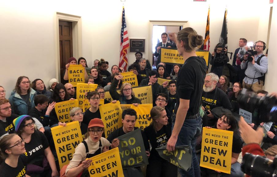 Activists stage a sit-in outside the office of Rep. Steny Hoyer (D-MD), who has yet to affirm his support for a special committee on a Green New Deal. CREDIT: Sunrise Movement