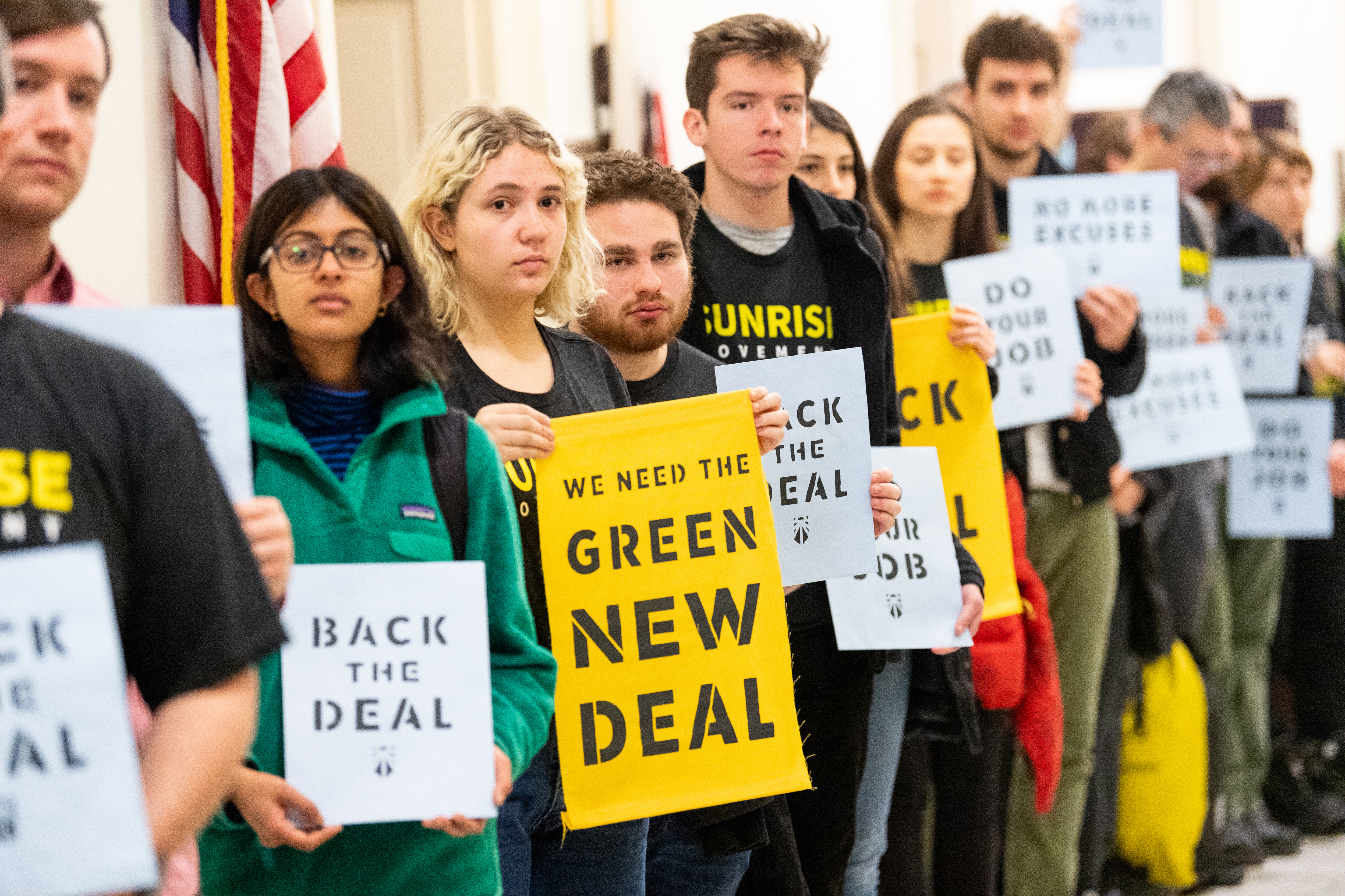 Sunrise Movement activists line up outside the office of Rep. Nancy Pelosi (D-CA) to urge support for committee to craft Green New Deal on December 10, 2018. CREDIT: Michael Brochstein/SOPA Images/LightRocket via Getty Images