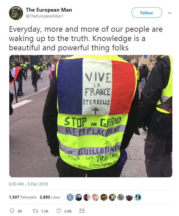 A Yellow Vest protester with ultranationalist phrases inscribed on it