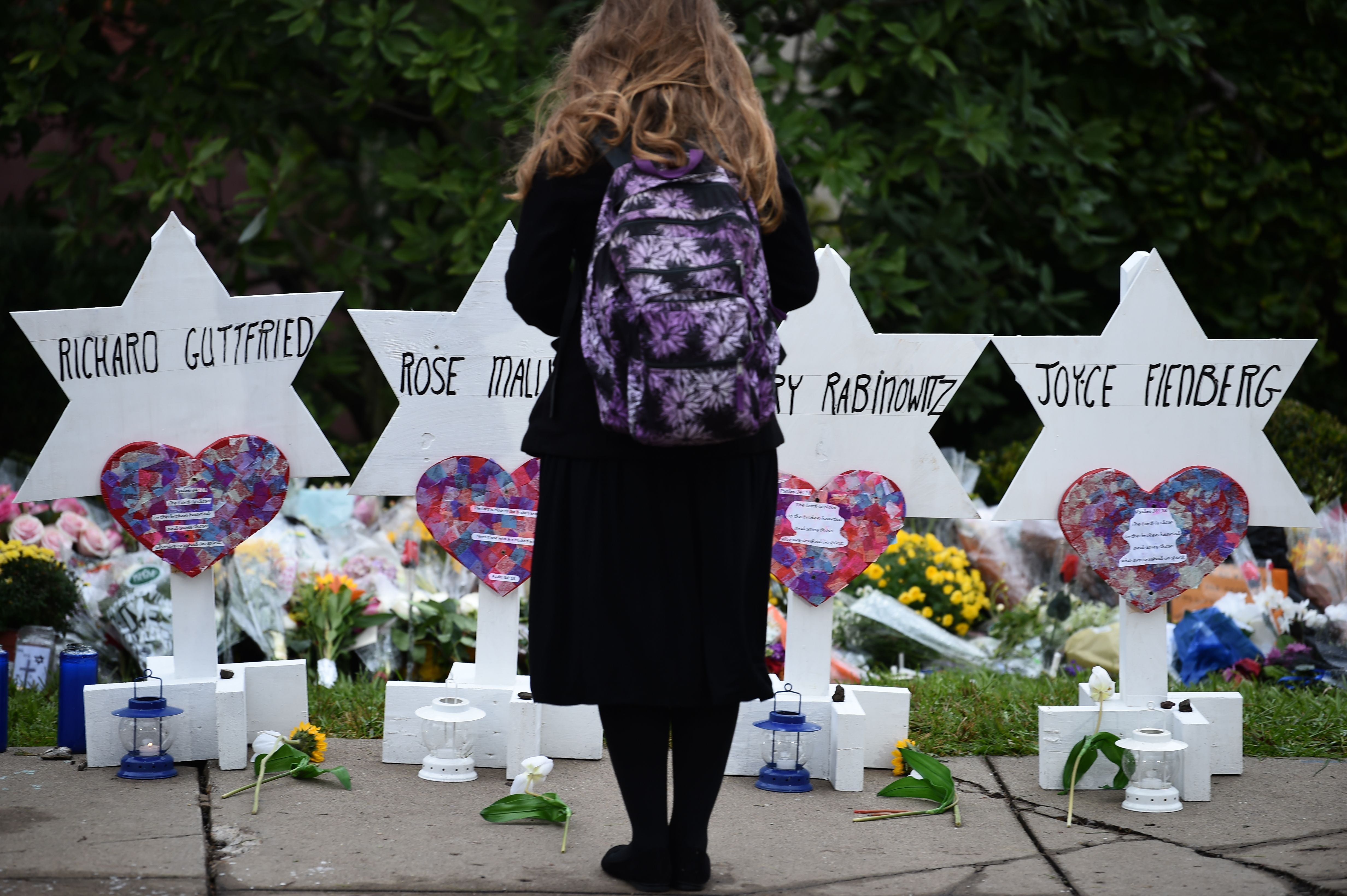 FILE PICTURE: A woman stands at a memorial outside the Tree of Life synagogue after a shooting there left 11 people dead in Pittsburgh on October 27. (Photo credit should read BRENDAN SMIALOWSKI/AFP/Getty Images)