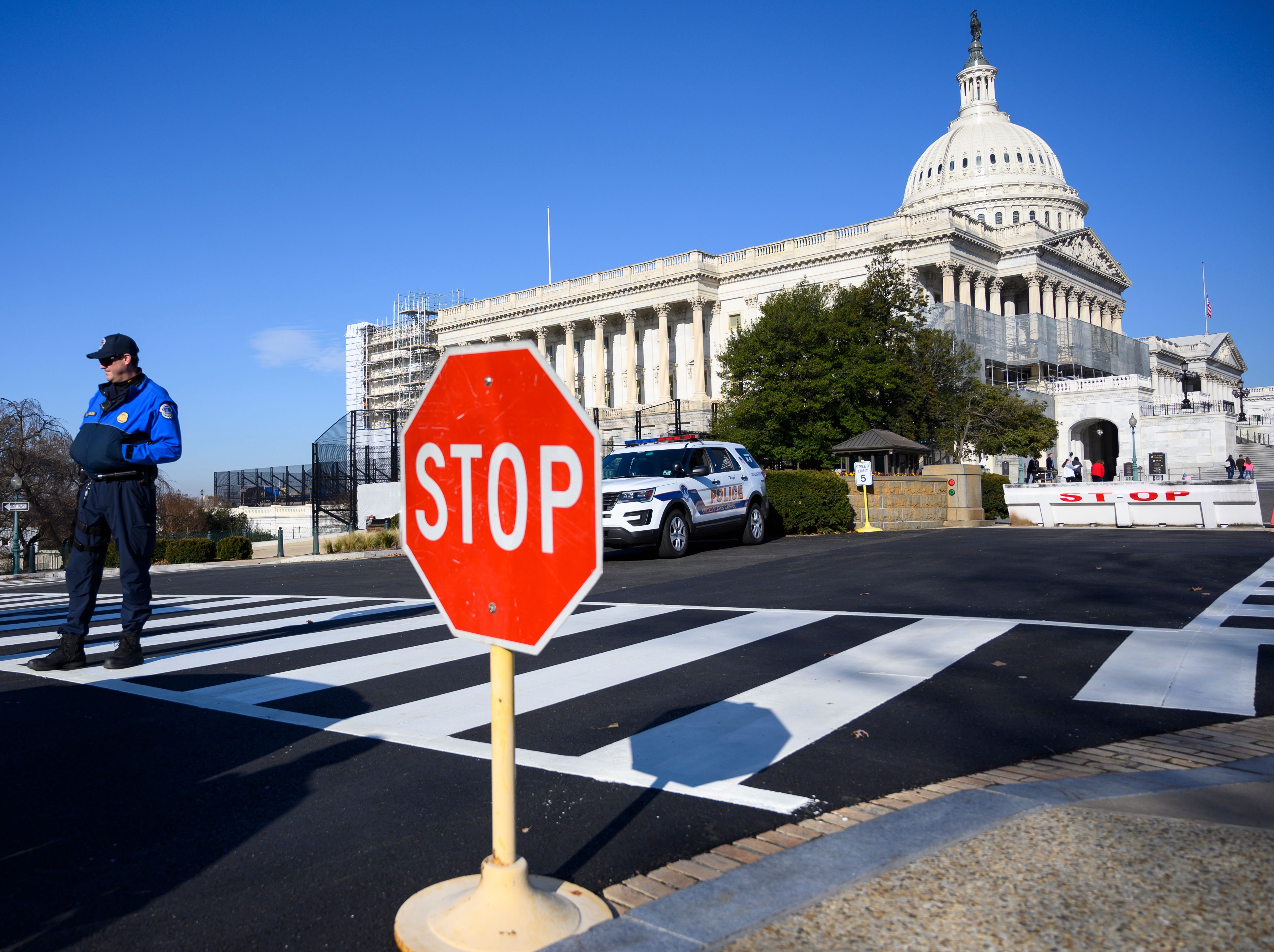 A police officer stands near the US Capitol during a government shutdown in Washington, DC, December 27, 2018. (PHOTO CREDIT: ANDREW CABALLERO-REYNOLDS/AFP/Getty Images)